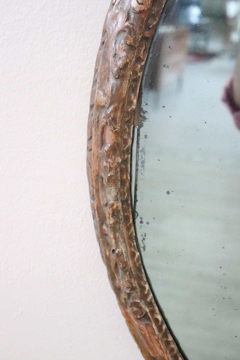 17th Century Italian Louis XIV Carved Wood Antique Oval Wall Mirror In Good Condition For Sale In Casale Monferrato, IT