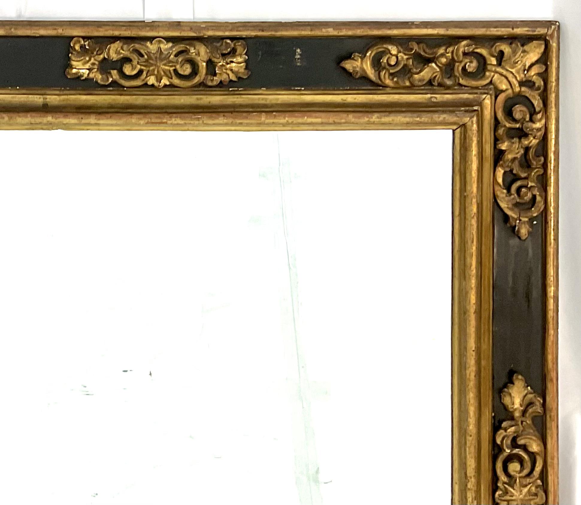 Italian Baroque black ebonized frame with carved applied gilt wood moldings. The raised applied giltwood moldings stand out dramatically with the ebonized wood background. A rare original frame in very good condition. Late 17th century. Can be hung