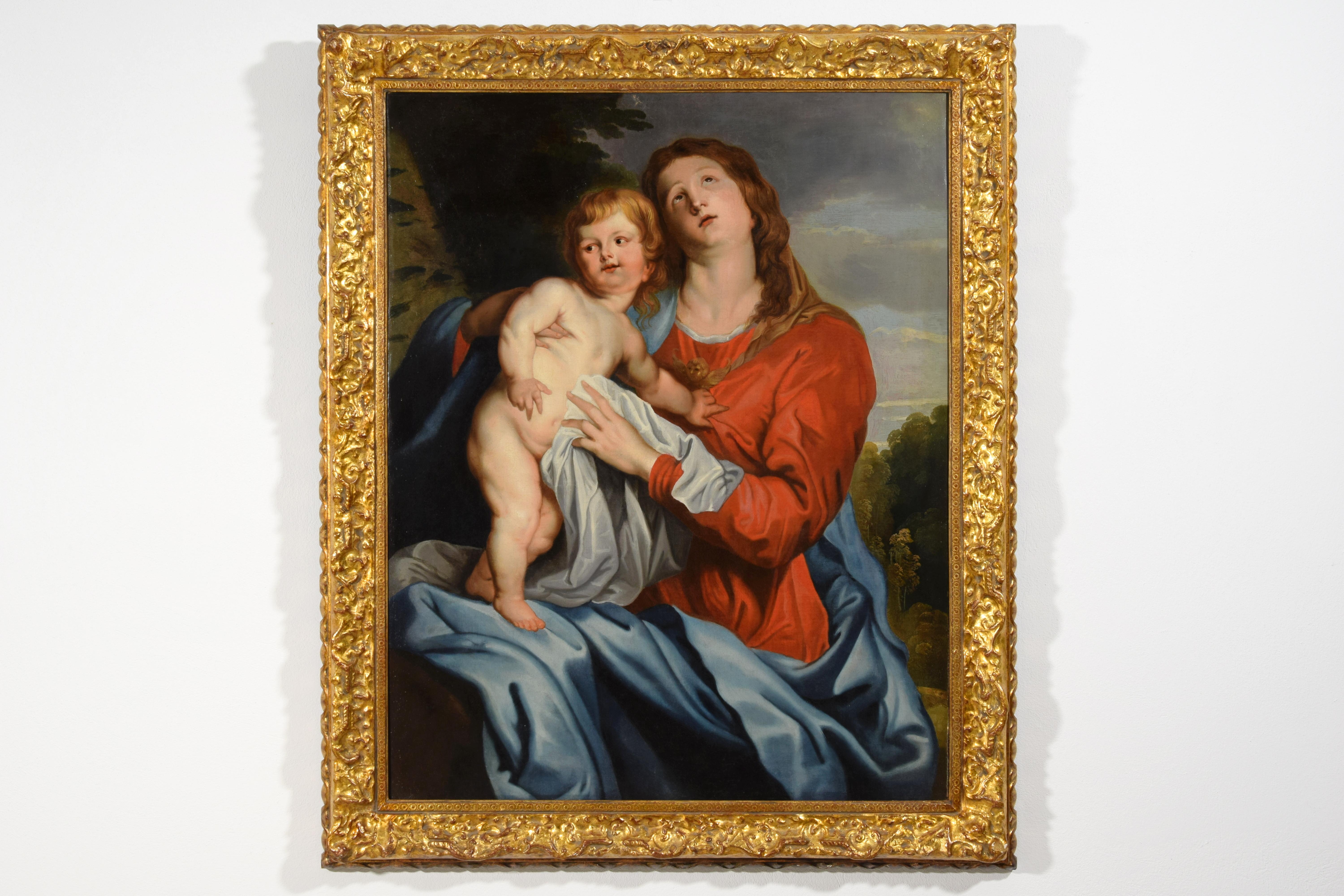 XVIIe siècle, peinture italienne avec une vierge et un enfant par un suiveur de Sir Anthony van Dyck

cm L 90 x H 113 ; corniche cm L 111 x H 135 x P 7
La toile représente la Madone avec l'Enfant sur ses genoux et est stylistiquement attribuable à