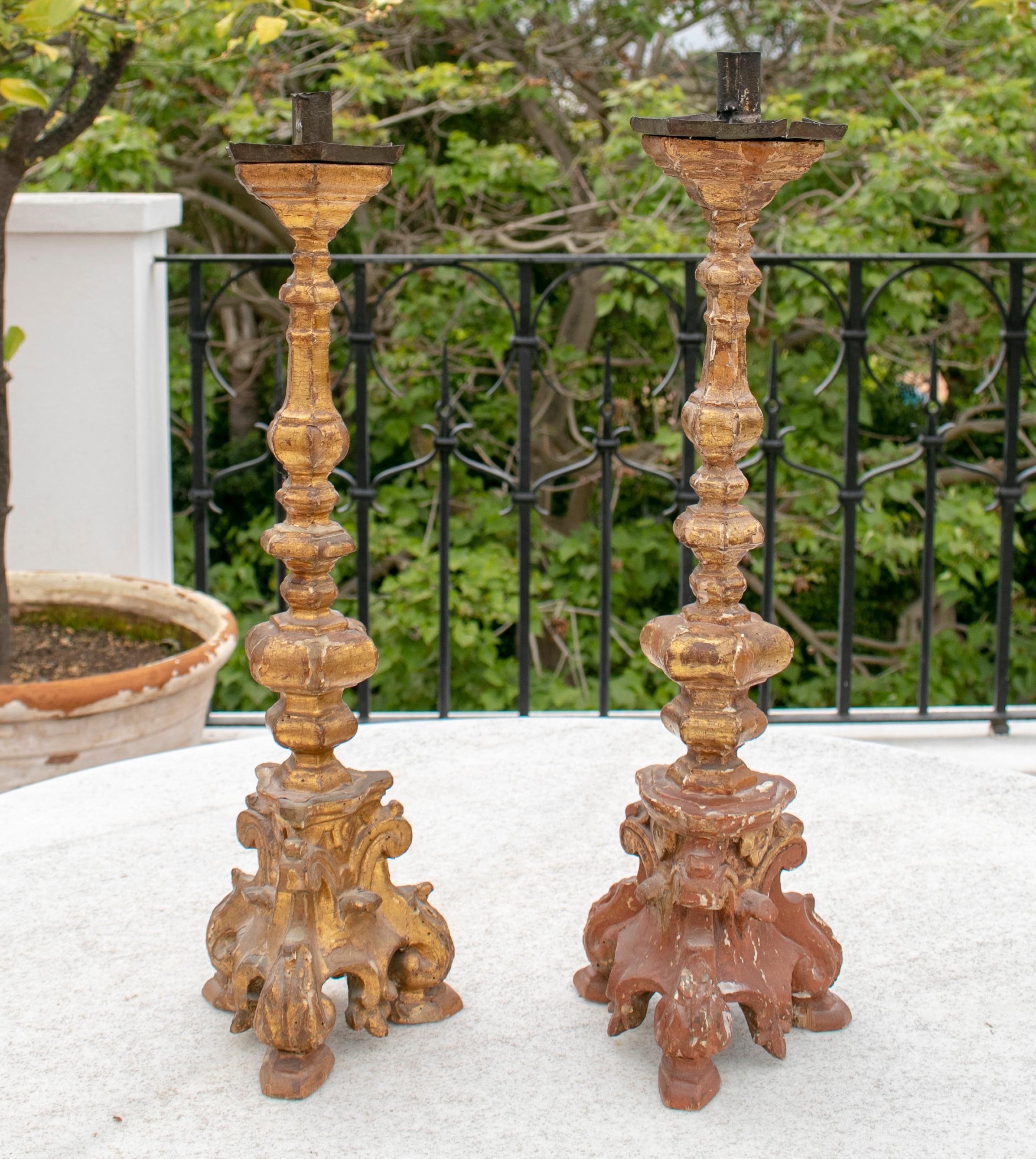 17th century Italian pair of giltwood candlesticks.