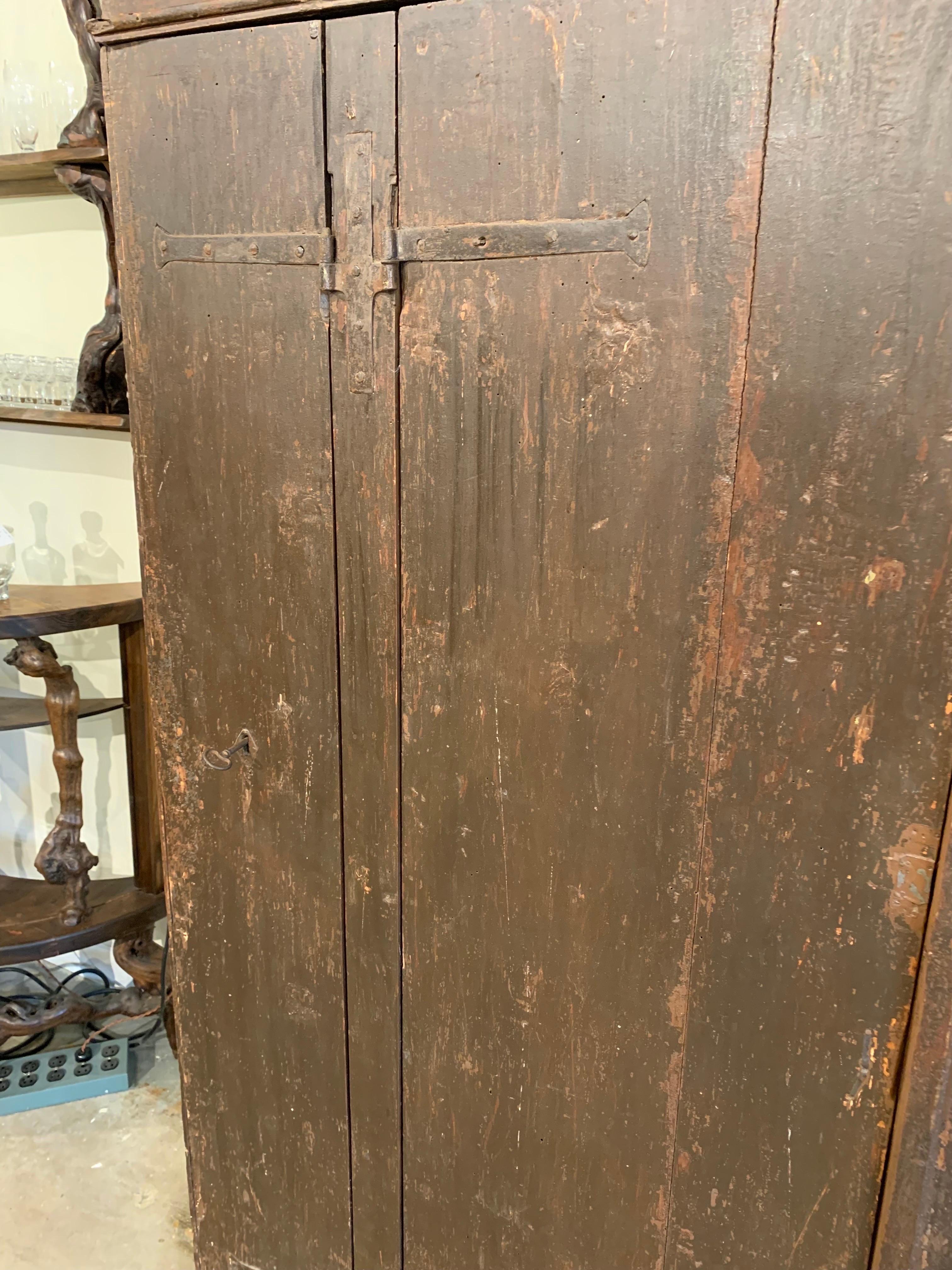 Hand-Crafted 17th Century Italian Patinated Pine Four Door Cabinet For Sale