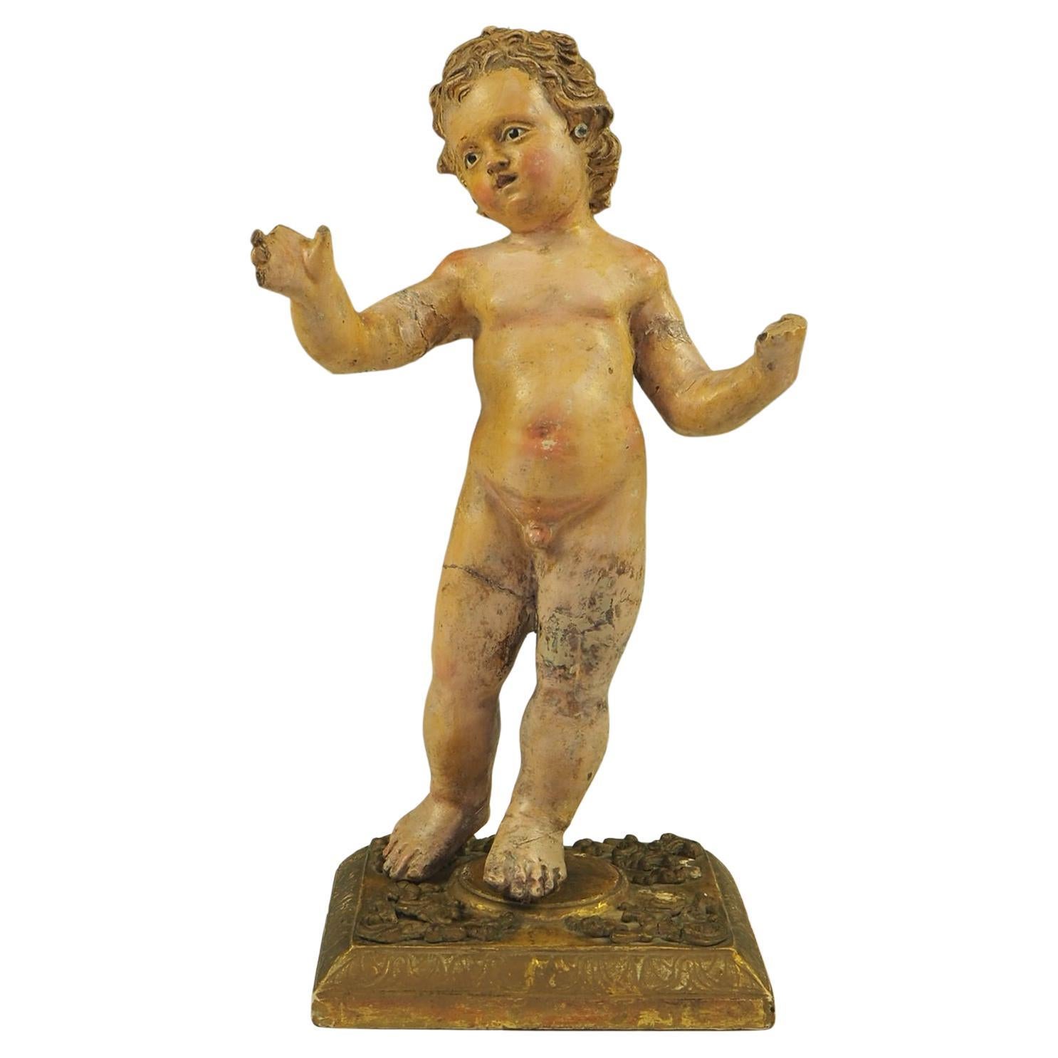 Figura di Gesù Bambino in terracotta dipinta in policromia del XVII secolo italiano in vendita