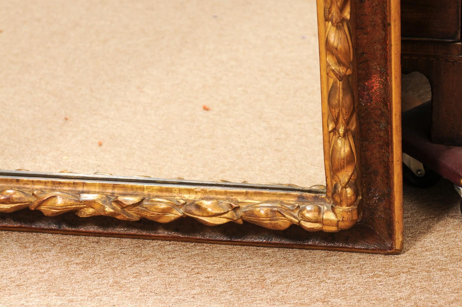 17th Century Italian Rectangular Brown Painted and Carved Parcel Gilt Mirror Madera en venta
