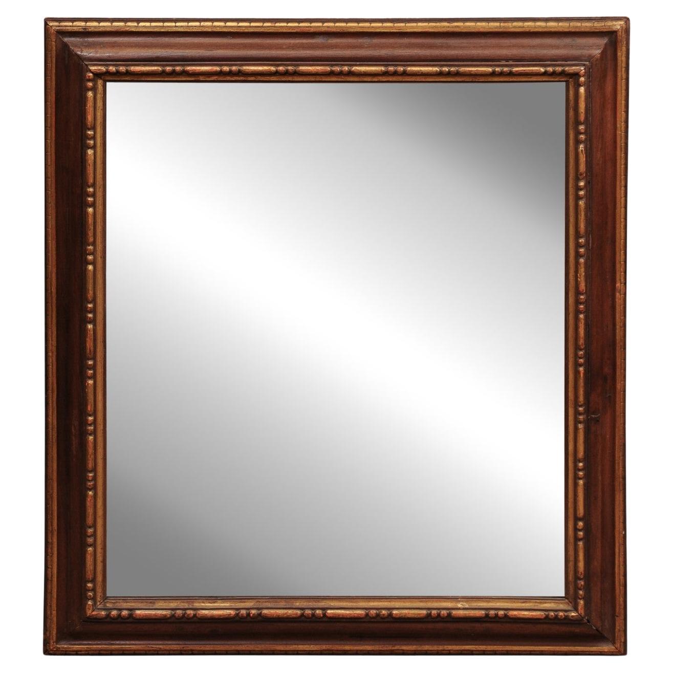 Miroir rectangulaire italien du 17ème siècle, peint en brun et sculpté en parcellaire et doré en vente