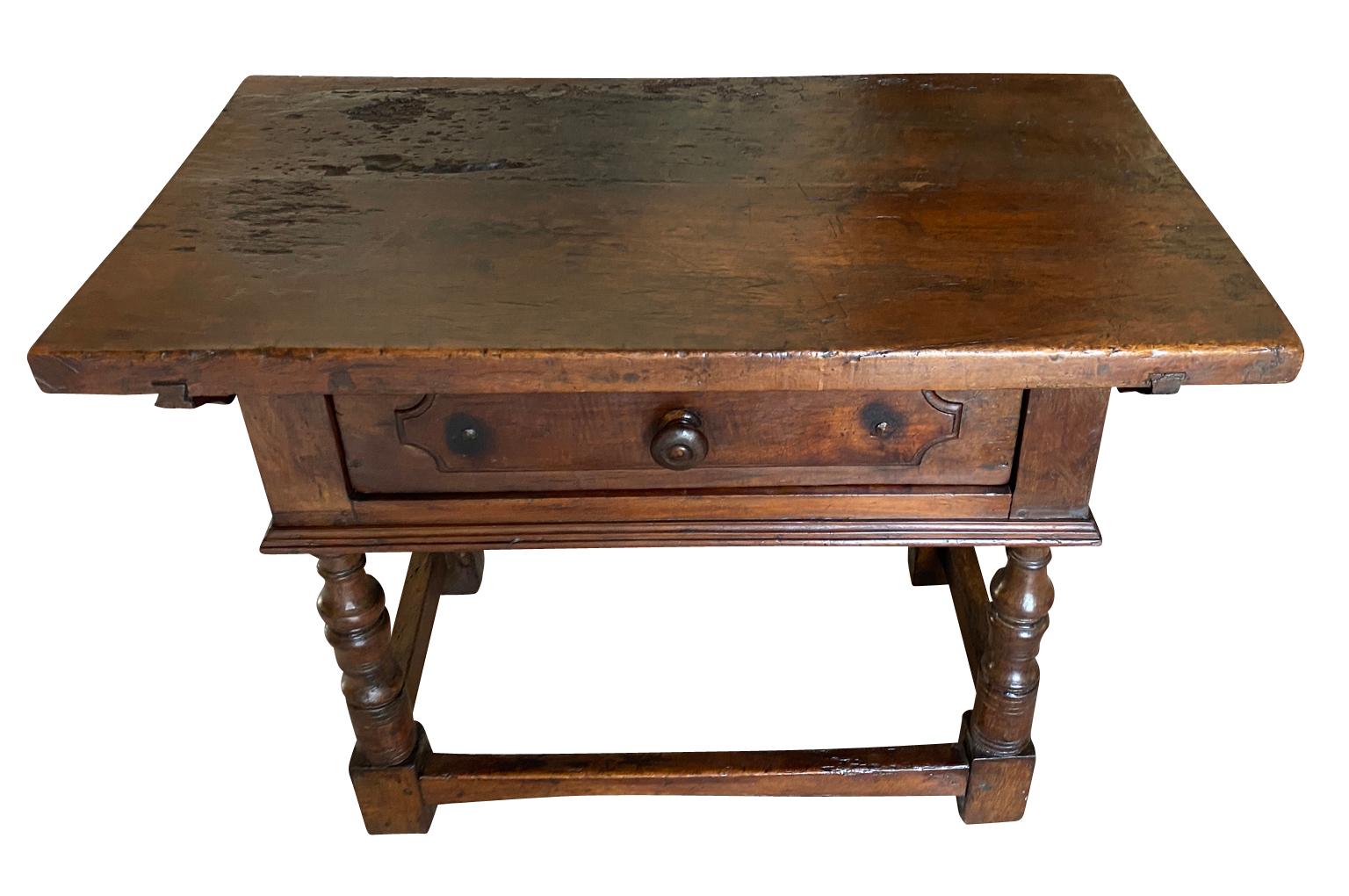 A very handsome 17th century side table from the Tuscan region of Italy. Beautifully constructed from walnut with a single drawer and nicely turned legs.