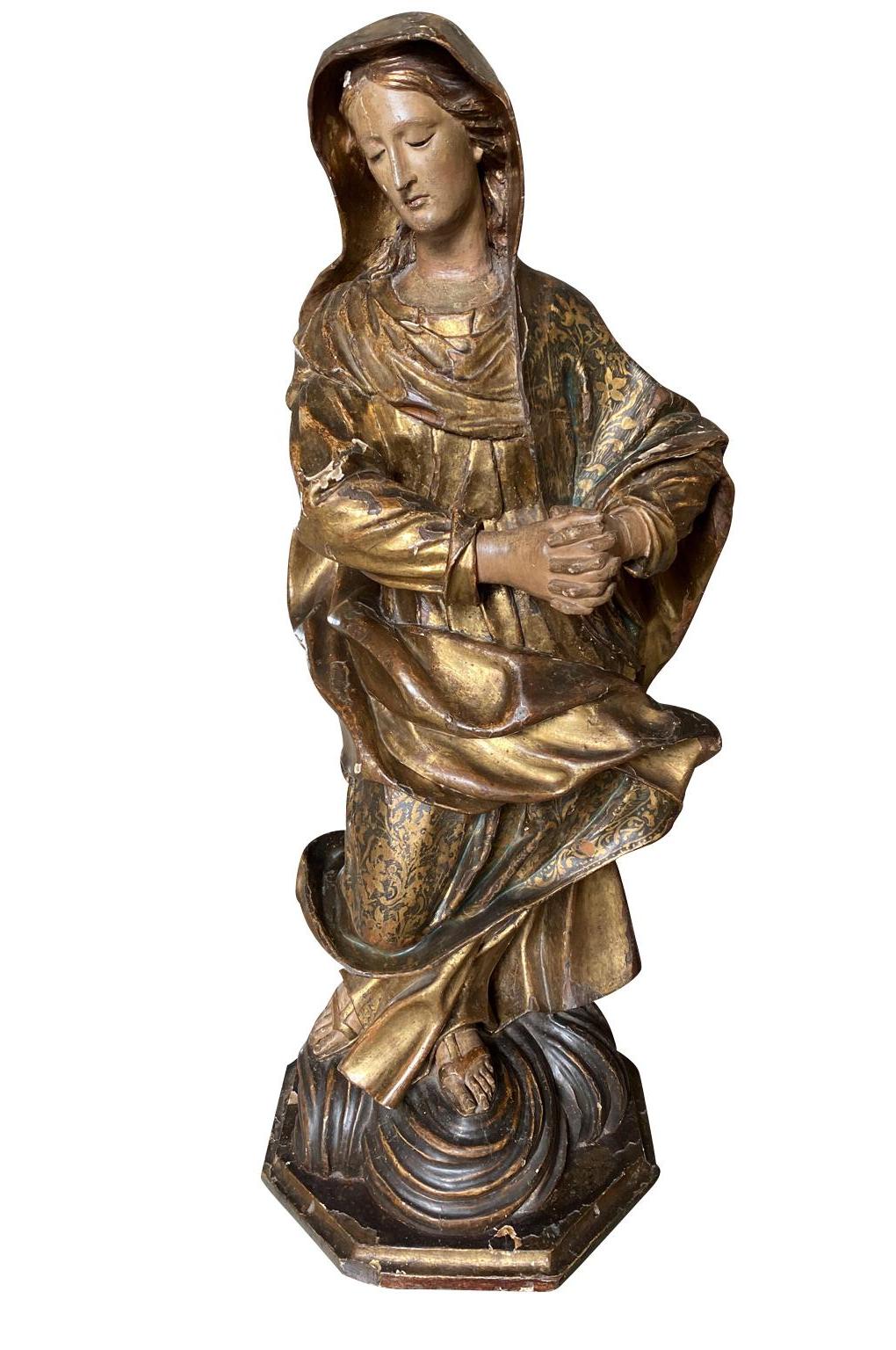 A breathtaking 17th century Statue of the Madonna from Venice. Beautifully crafted from polychromed and gilt wood. Exquisite features.