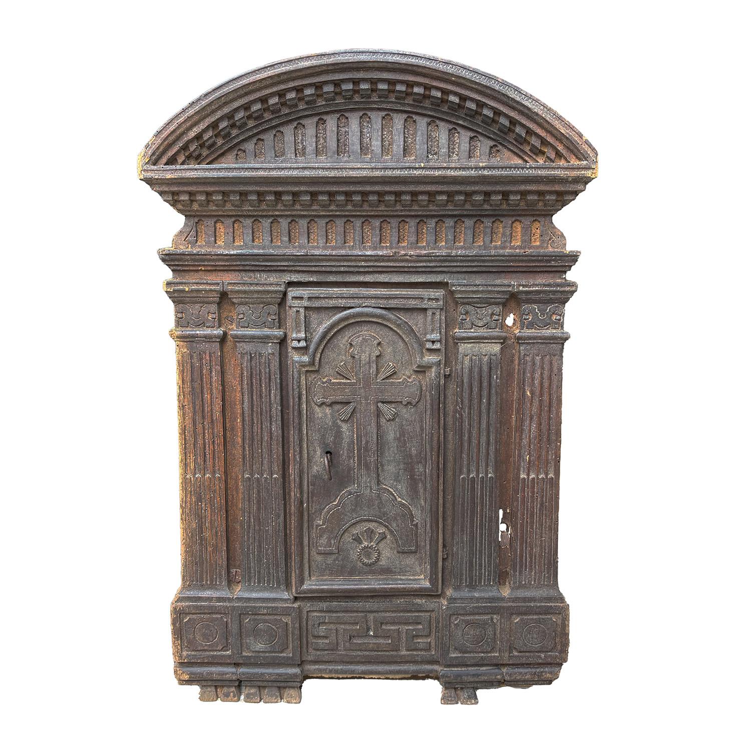 A late 17th Century, antique Renaissance Tabernacle door made of hand crafted Walnut, in good condition. The detailed wall panel décor piece is composed with a small door, enhanced by a red fabric cover, consisting its original metal hardware and