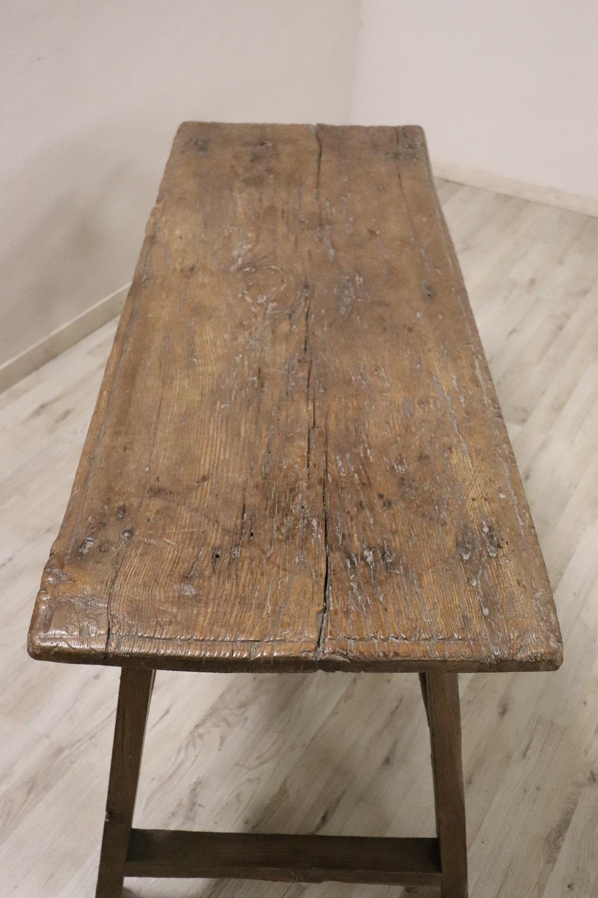 Important antique solid oakwood table from the 17th century. Oakwood has acquired a beautiful antique patina presenting the signs of all the past centuries. This type of table in Italy was called 