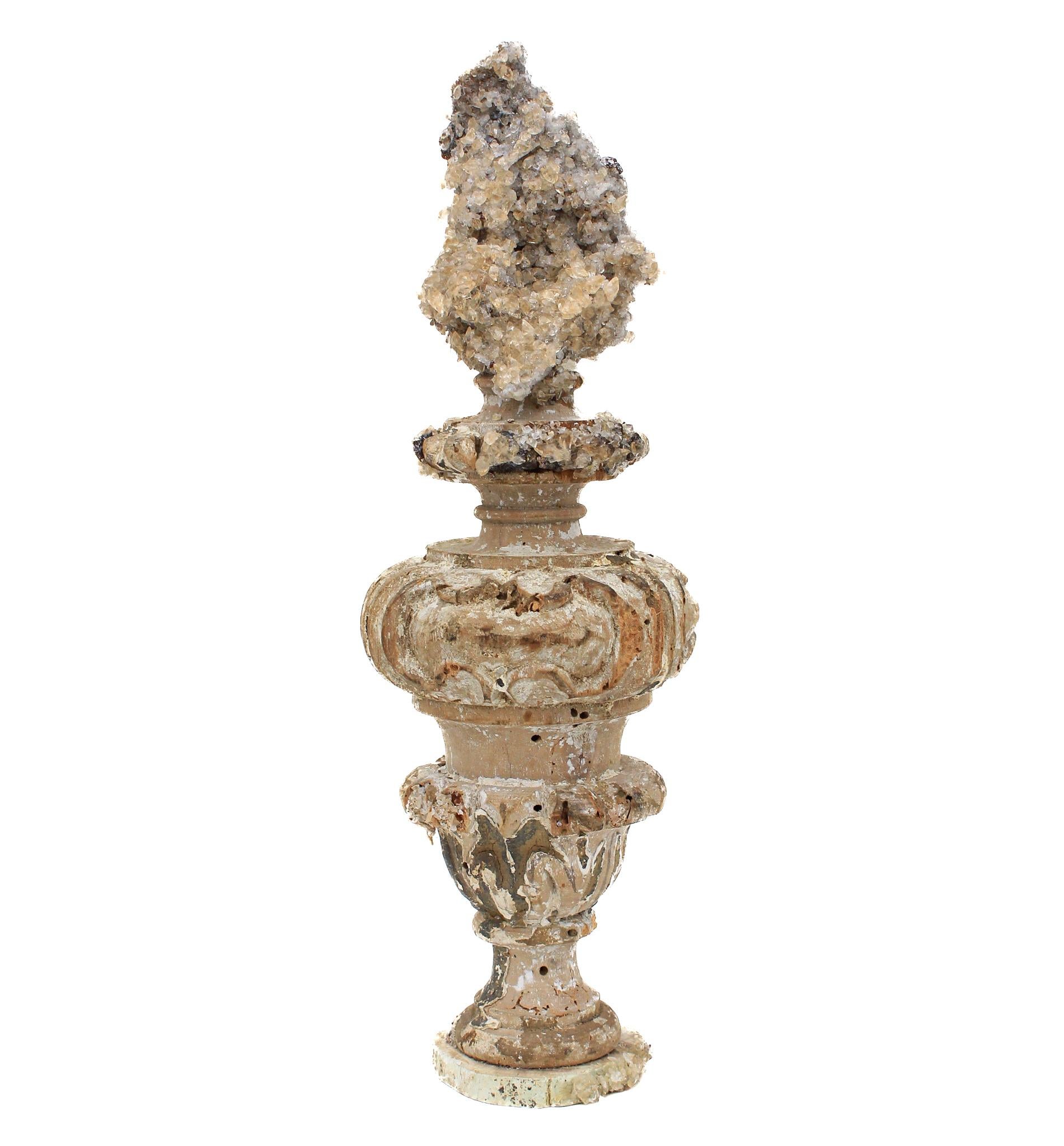 17th century Italian vase with a calcite crystal cluster in matrix on a petrified wood base.

This fragment is from a church in Florence. It was found and saved from the historic flooding of the Arno River in 1966.

The calcite crystal cluster with