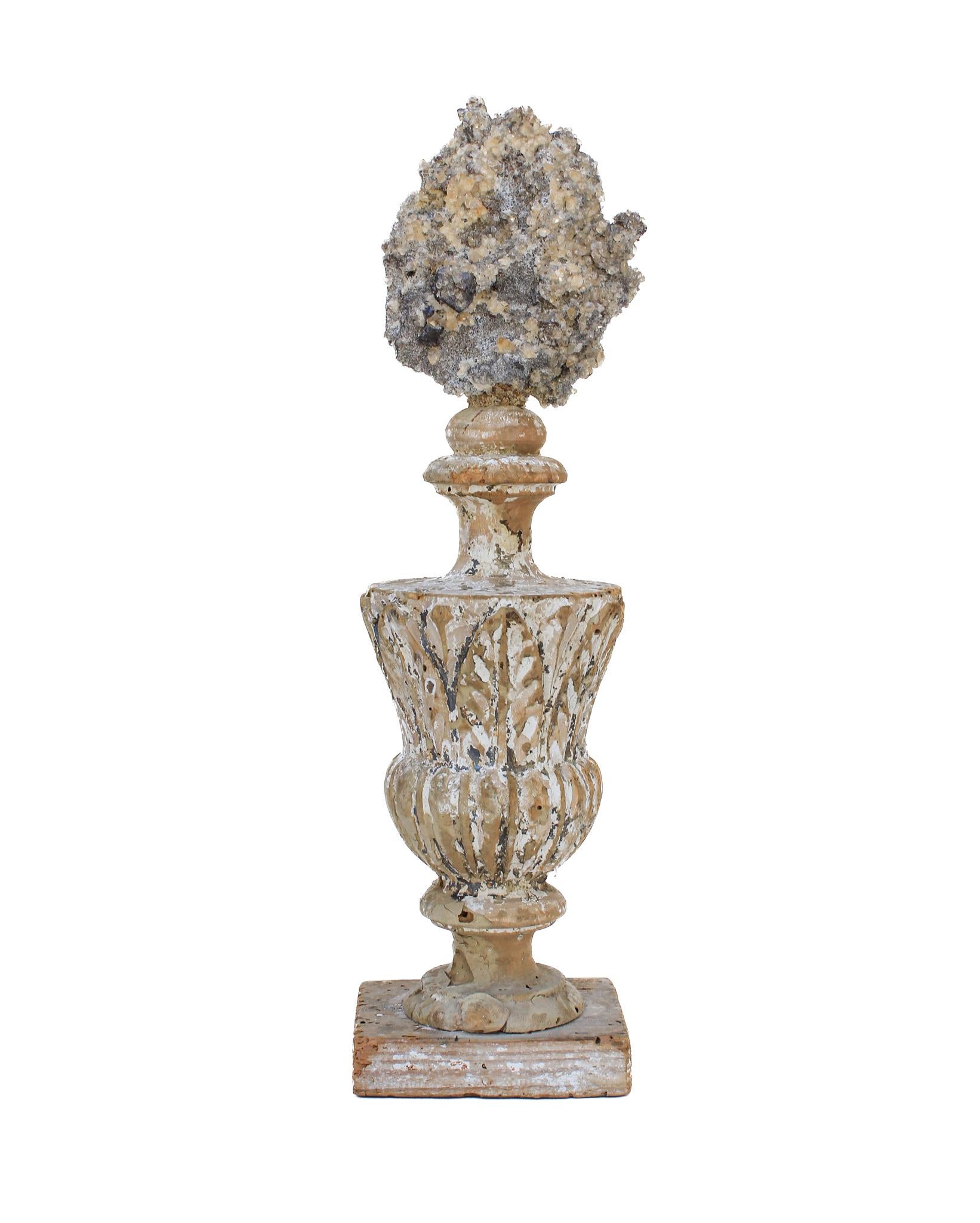 17th century Italian vase with a calcite crystal cluster in matrix with sphalerite.

This fragment is from a church in Florence. It was found and saved from the historic flooding of the Arno River in 1966.

The calcite crystal cluster with