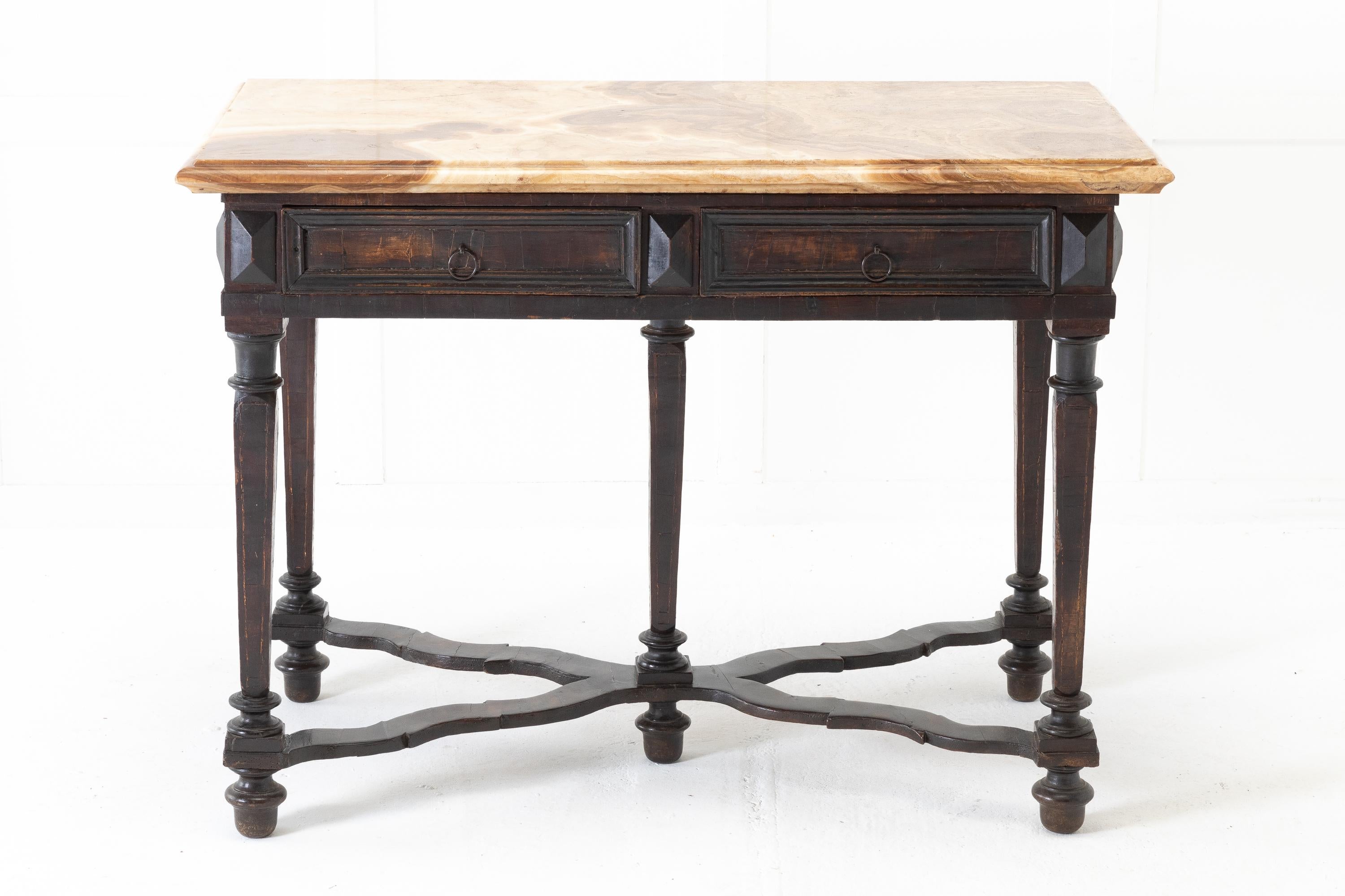 17th Century Italian walnut side table with stunning, solid alabastro fiorito top. Having two moulded panel frieze drawers with ring pull handles on one side. Supported by square, slightly tapering and turned legs, joined by a carved cross stretcher