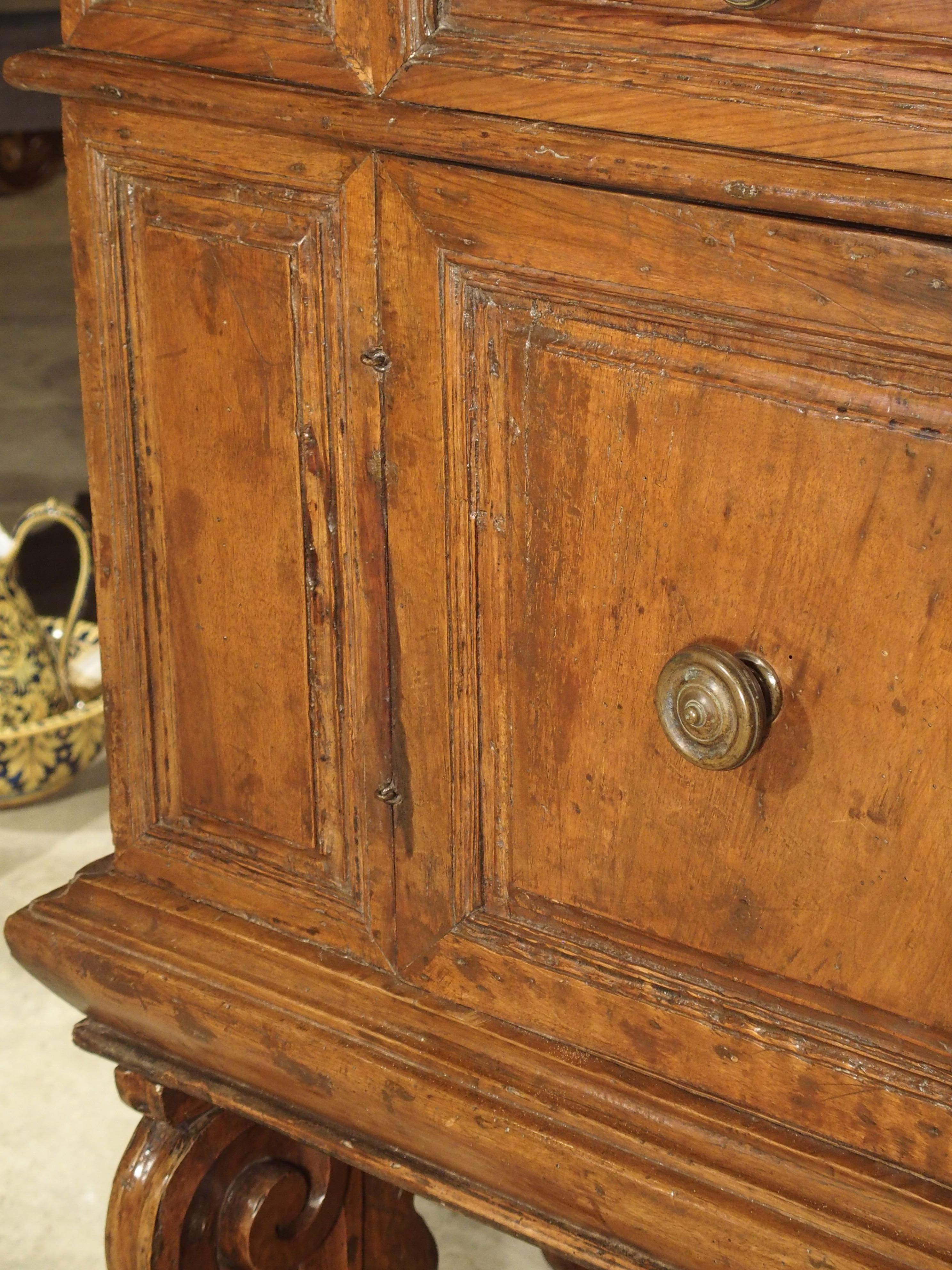 This 17th century walnut wood cabinet comes from Italy and is known as a “madia”. A madia is a wide sideboard designed to hold an ample supply of loaves of bread, typically before baking. Although they have been in use for centuries, a madia