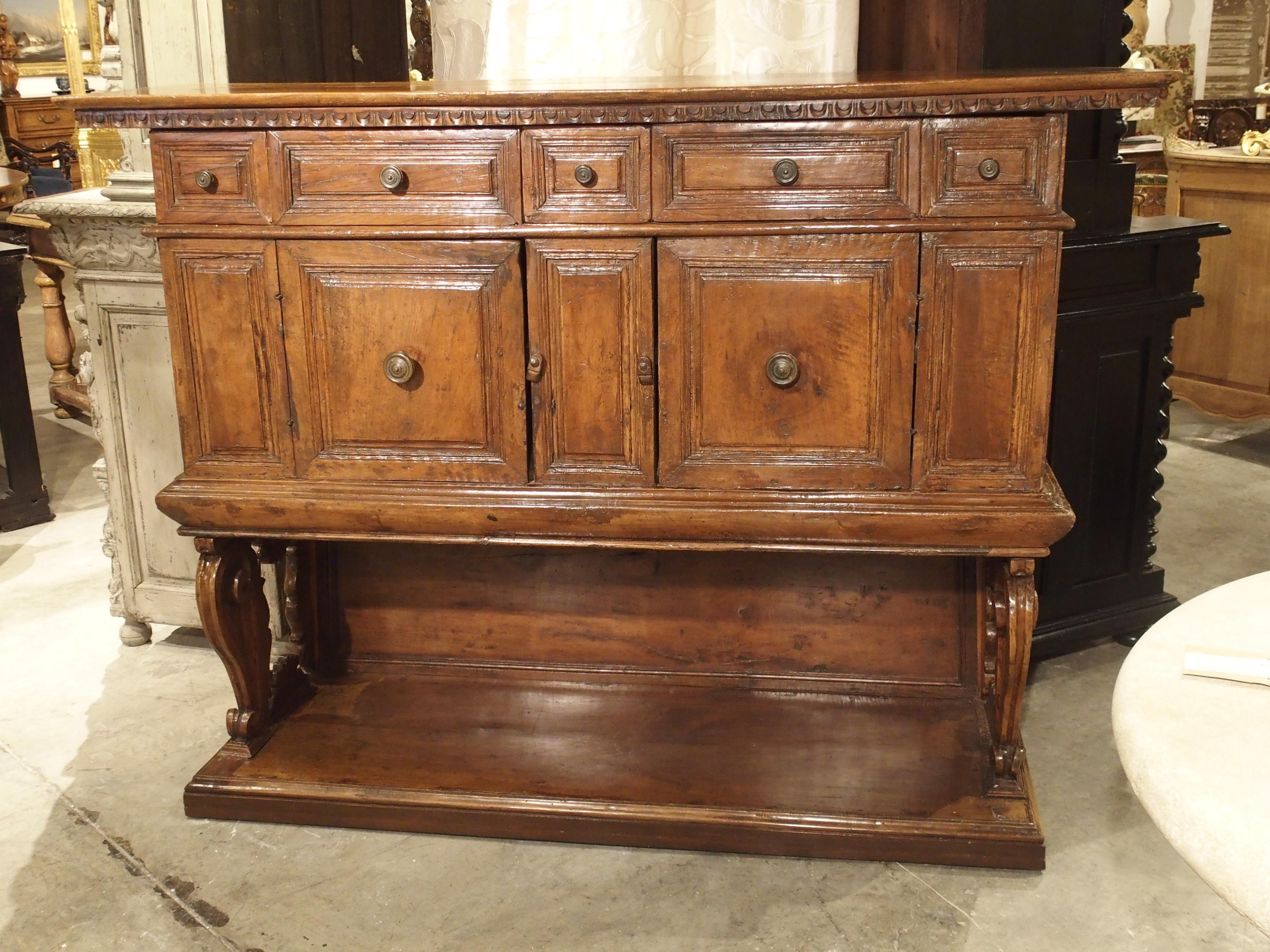 Brass 17th Century Italian Walnut Wood “Madia” Cabinet with Carved Bracket Base