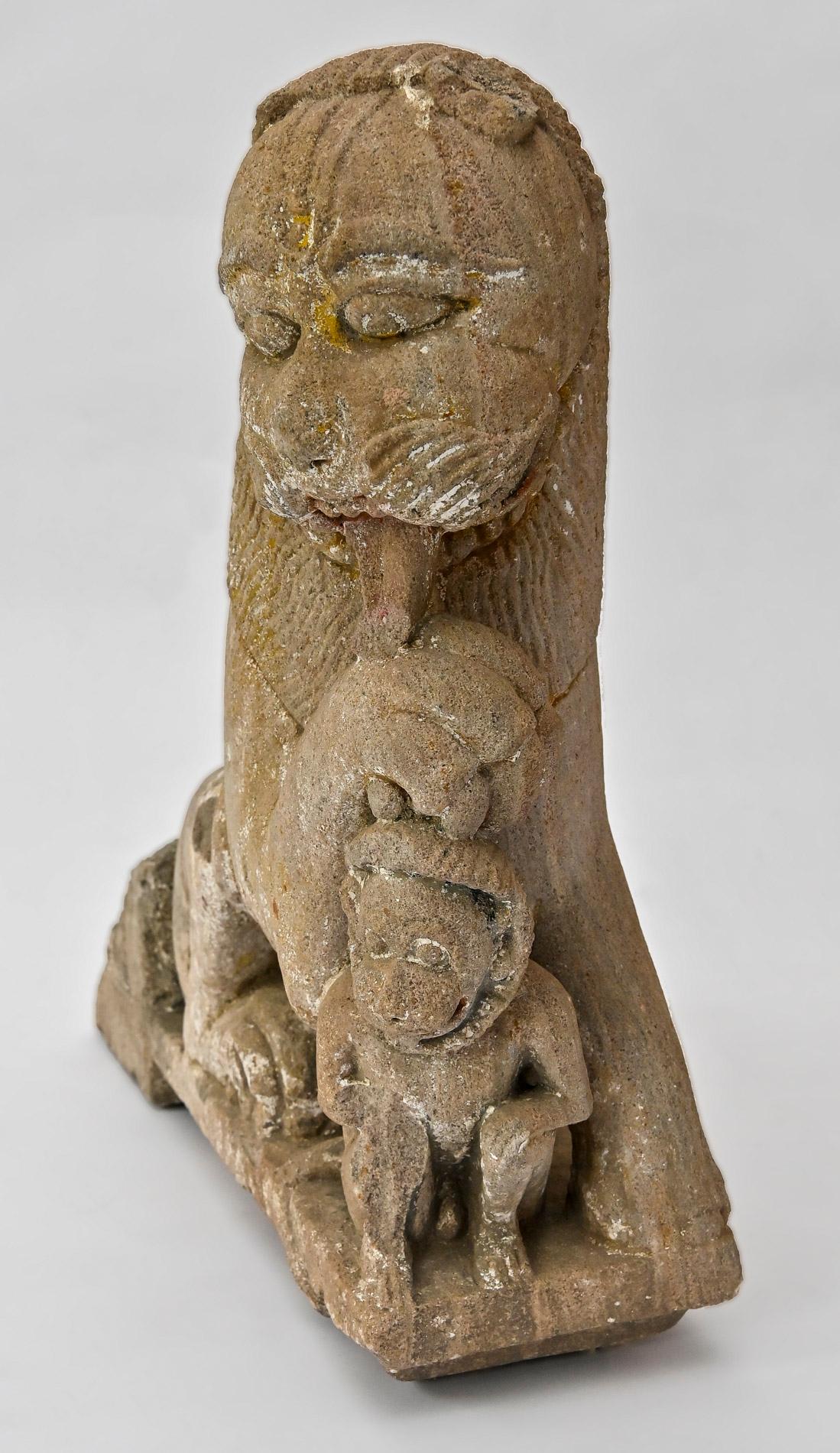 17th Century sculpture stone lion holding a monkey.
This very decorative Piece was once built into a building as a striking focal point. The depiction of a lion and a monkey interacting together is rather rare, which is why this item so special. It