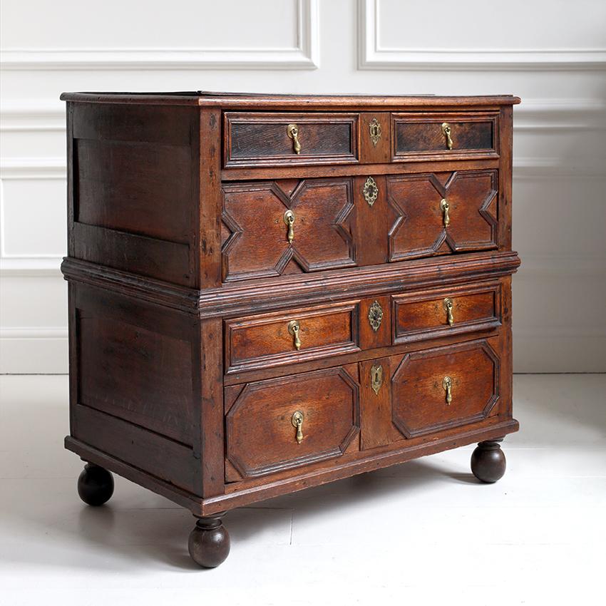 A superb example of early English craftsmanship, this 17th Century Jacobean chest is a rare and characterful piece for the modern interior.

Hand-crafted from patinated oak, it features a classic arrangement of five drawers beautifully detailed with