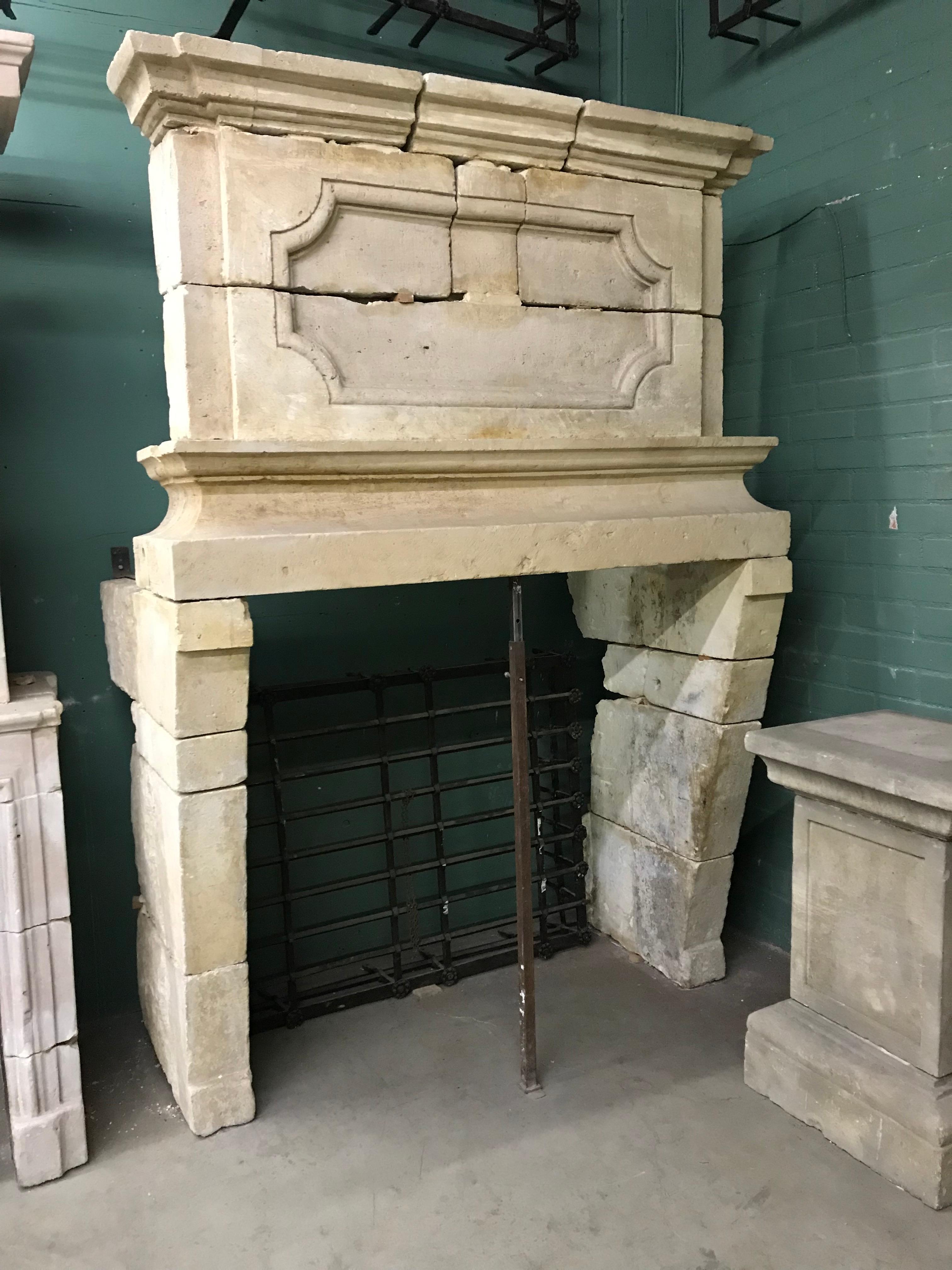  Extremely Rare 17th Century Louis XIII Chateau Fireplace, 1610-1643
 Rare and unique French antique castle fireplace Louis XIII period Limestone Chimney with a magnificent Trumeau Top . 

Dimensions of fireplace With Trumeau top dimensions Height