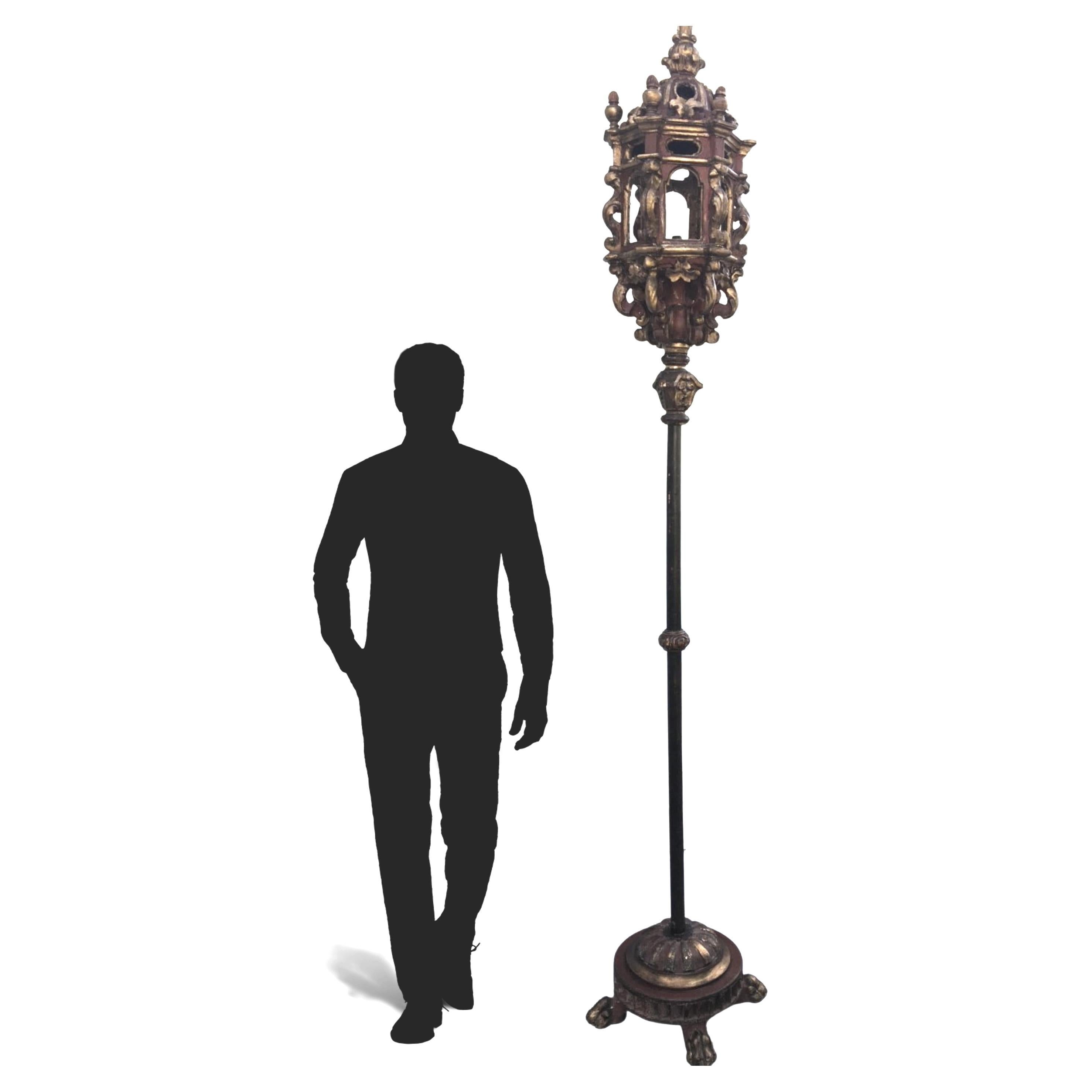 17th century large six sided Venetian carved gilded Baroque hall lantern.

This 17th century hand carved red polychrome and gilded wood lantern, mounted on a pole with a lion paw base, represents the highest standards of craftsmanship. This very