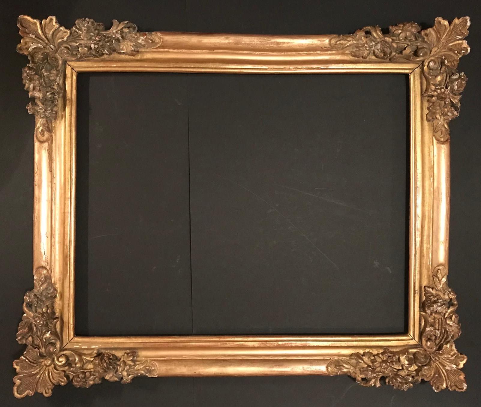 This significant and rare frame dates from the period of Louis XIV, the French Sun King. The rich decoration is hand carved in great detail and gilded over gesso. The fantastic design is a typical example of 17th century French Baroque frames.