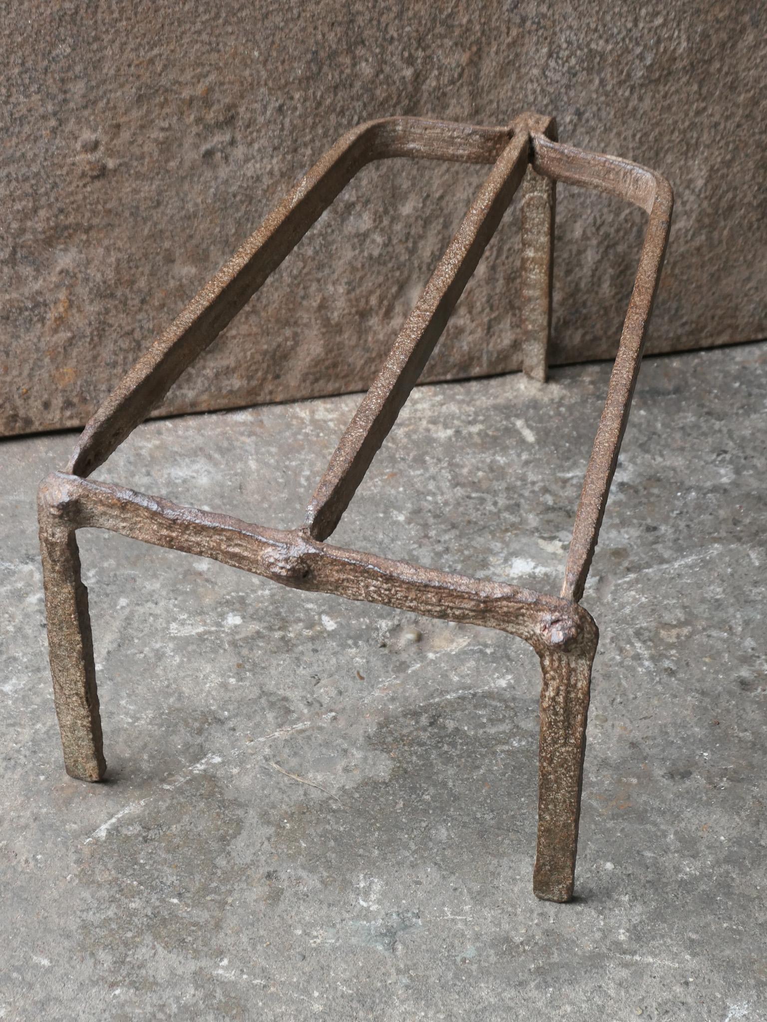 17th century French Louis XIV Period trivet. 

It is used for heating up a pan or to keep it warm in front of the fire. In a good working condition.