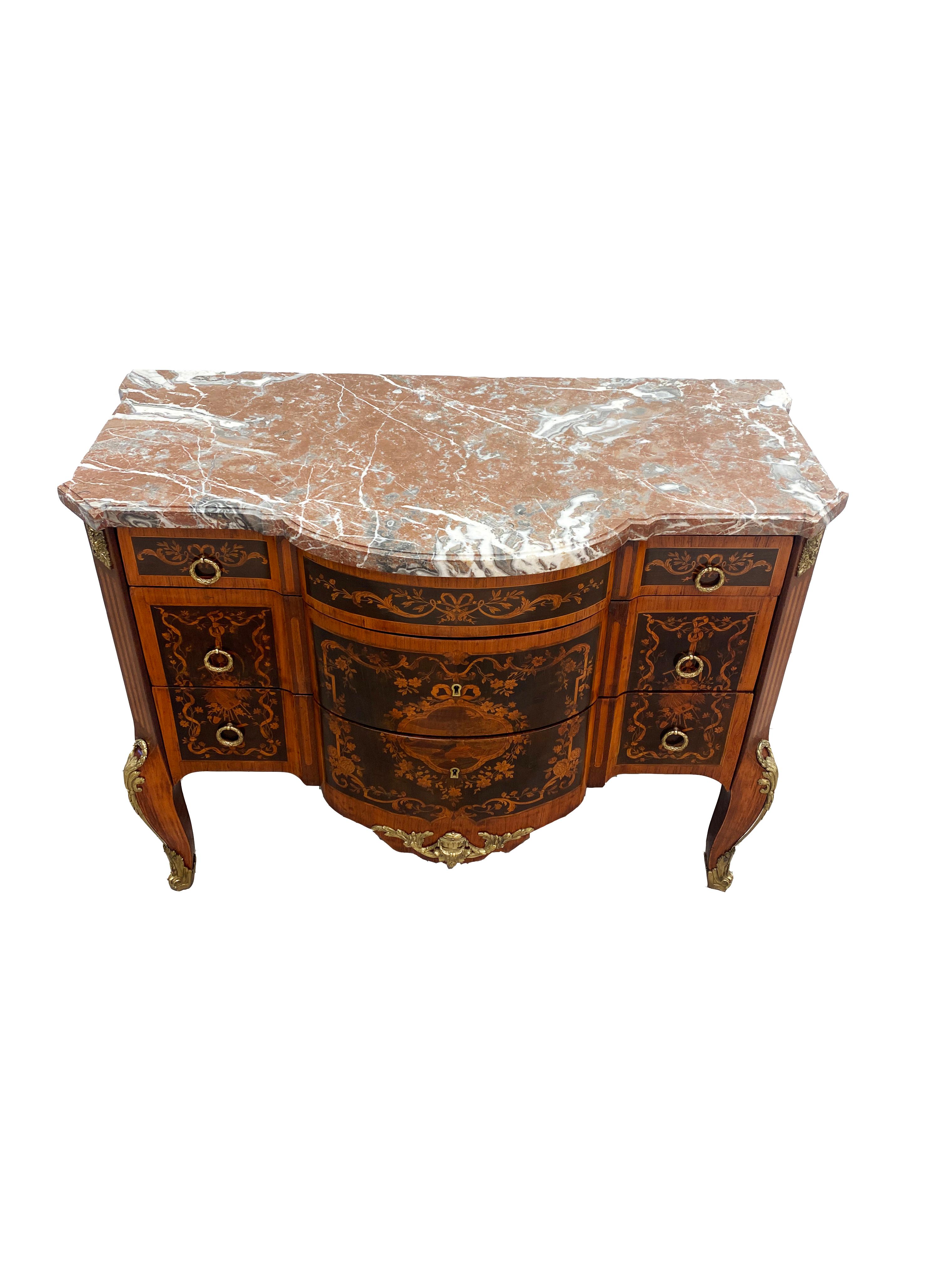 A handsome period Louis XVI commode from the later half of the 18th century. Heavy use of marquetry and parquetry inlays using tulipwood, kingwood and rosewood throughout the sides and drawer fronts the case was constructed with oak. The legs