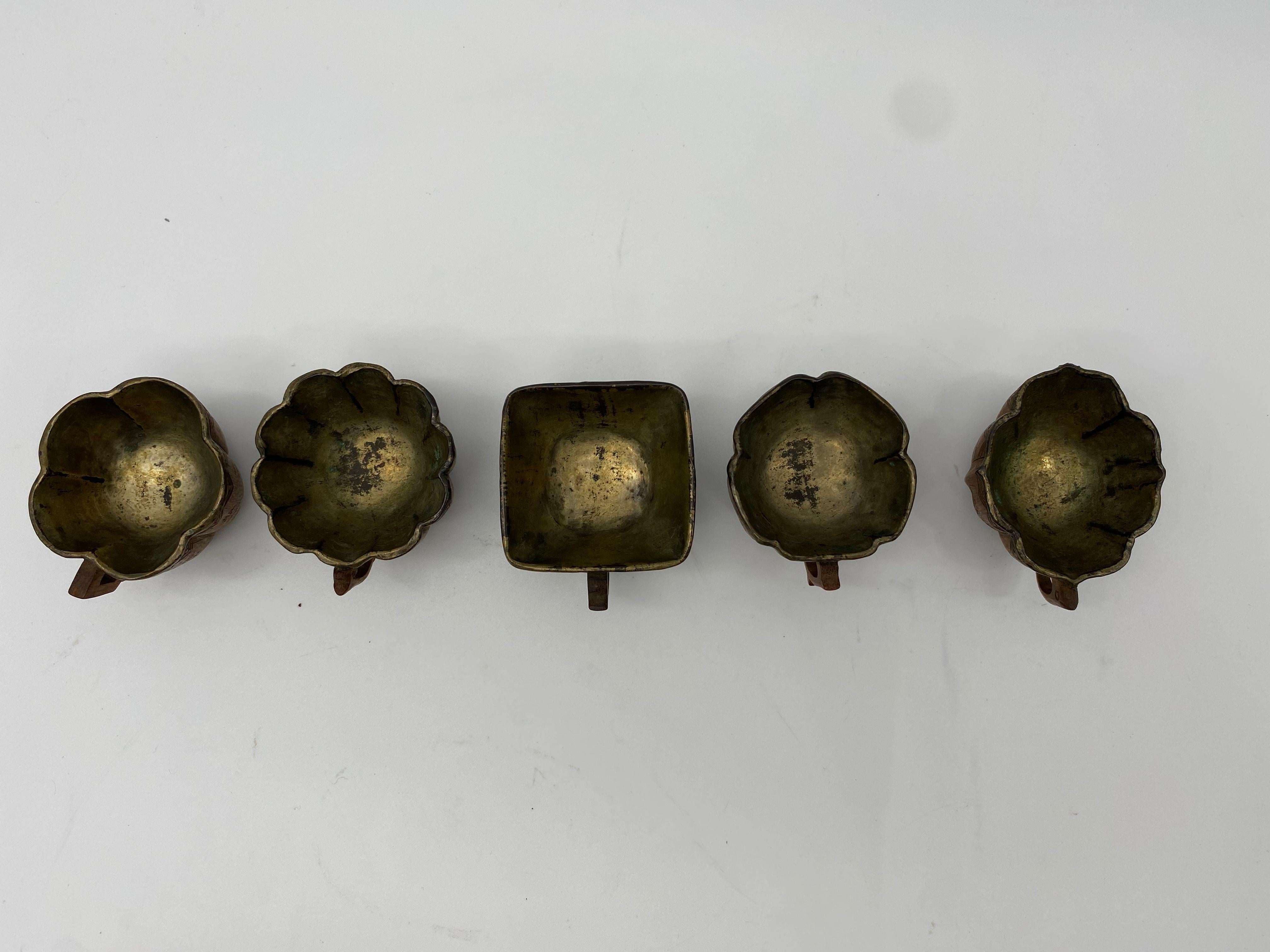 A fine set of 5pieces Chinese bamboo tea cups with silvered interiors from the 17th century Qing Dynasty, the faces each of each decorated to the exterior bamboo with Chinese words , all with carved floral depictions and inscribe poems , interior is