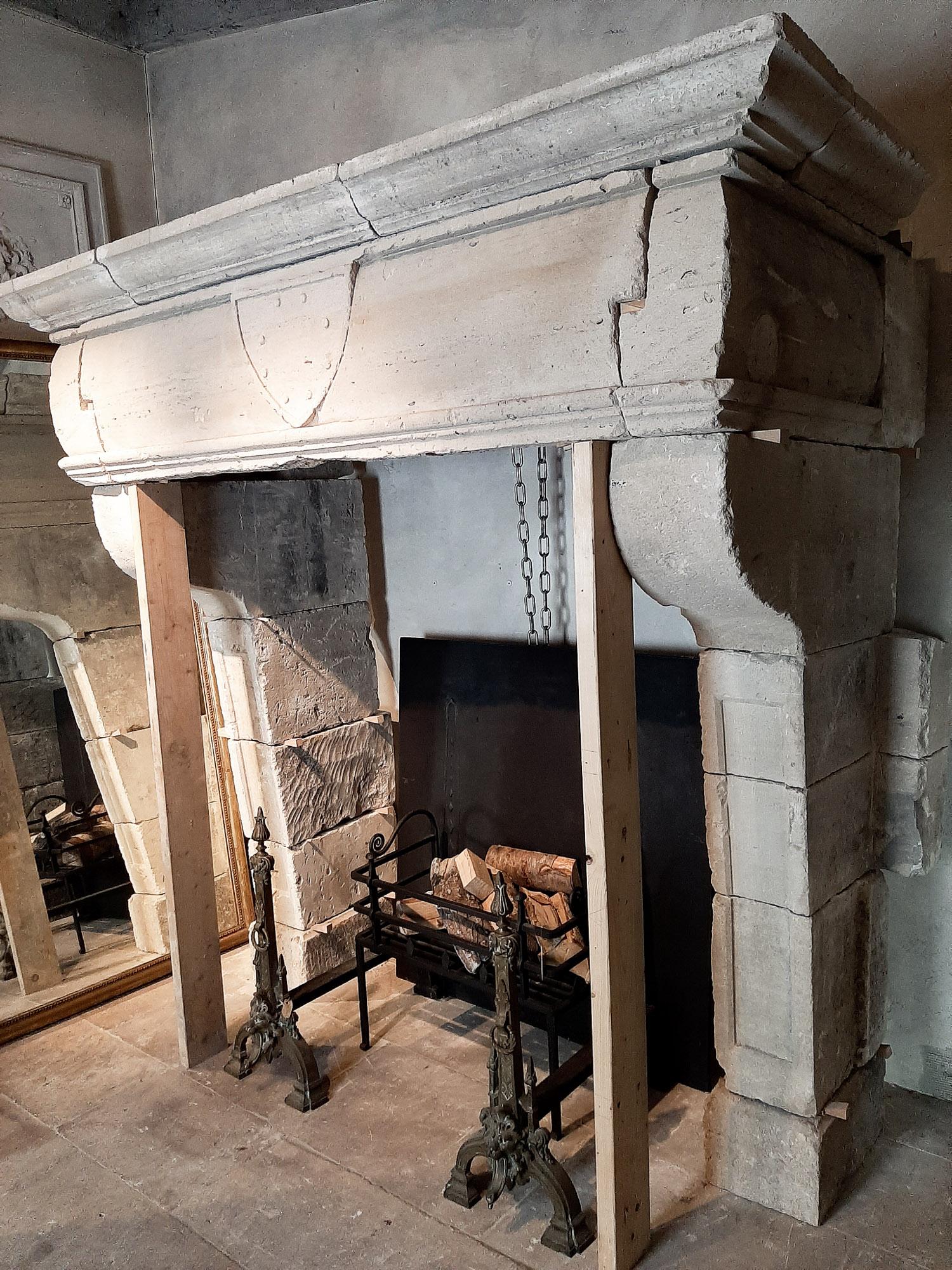 18th Century and Earlier 17th Century Monumental French limestone Mantlepiece For Sale