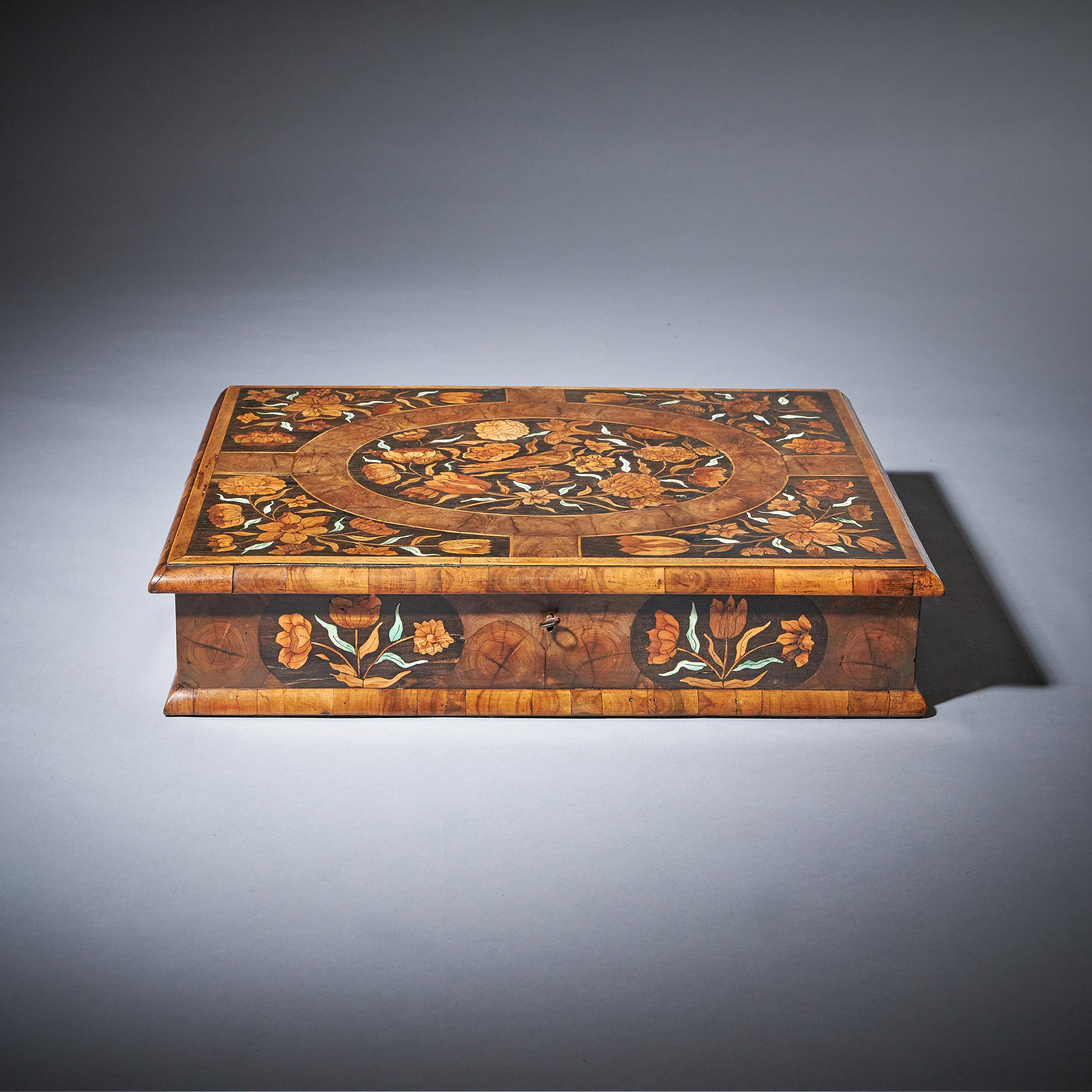 17th century Museum Grade William and Mary Olive Oyster Marquetry Lace box, C. 1670-1690. England

The ovolo-moulded and holly banded top is centred by an oval of marquetry depicting spring flowers bordered in oysters of olive finely strung to