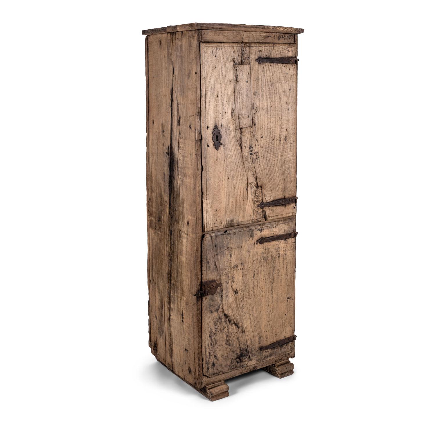 17th century naturally bleached chestnut cupboard from Spain. Simple shape fitting with original iron hinges and latch. Lock old but not original.
