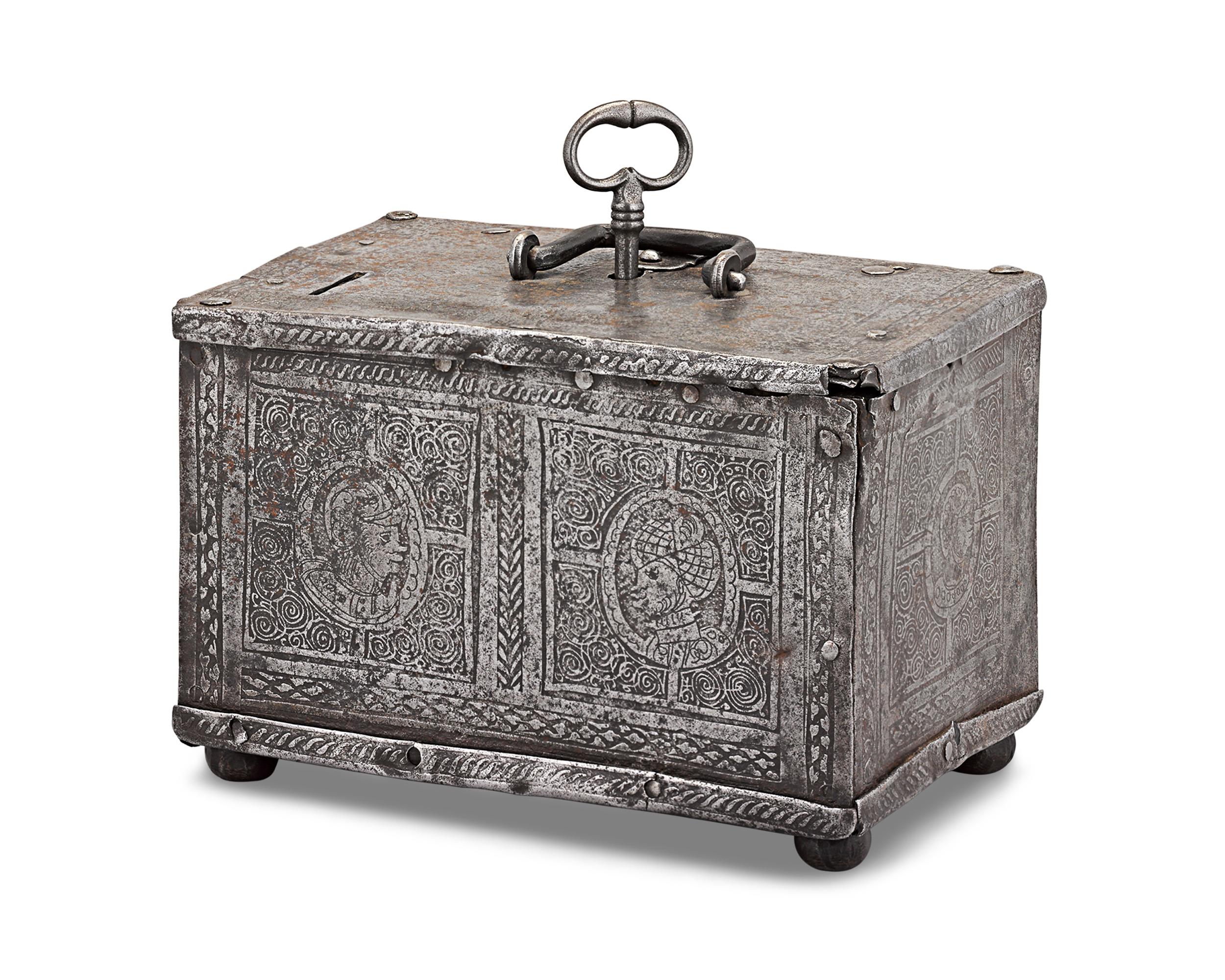 Dating to the turn of the 17th century, this incredibly rare German etched steel casket opens to reveal an elaborate locking device under its lid. Bearing the qualities of chests made in the southern German city of Nuremburg, the exterior of this