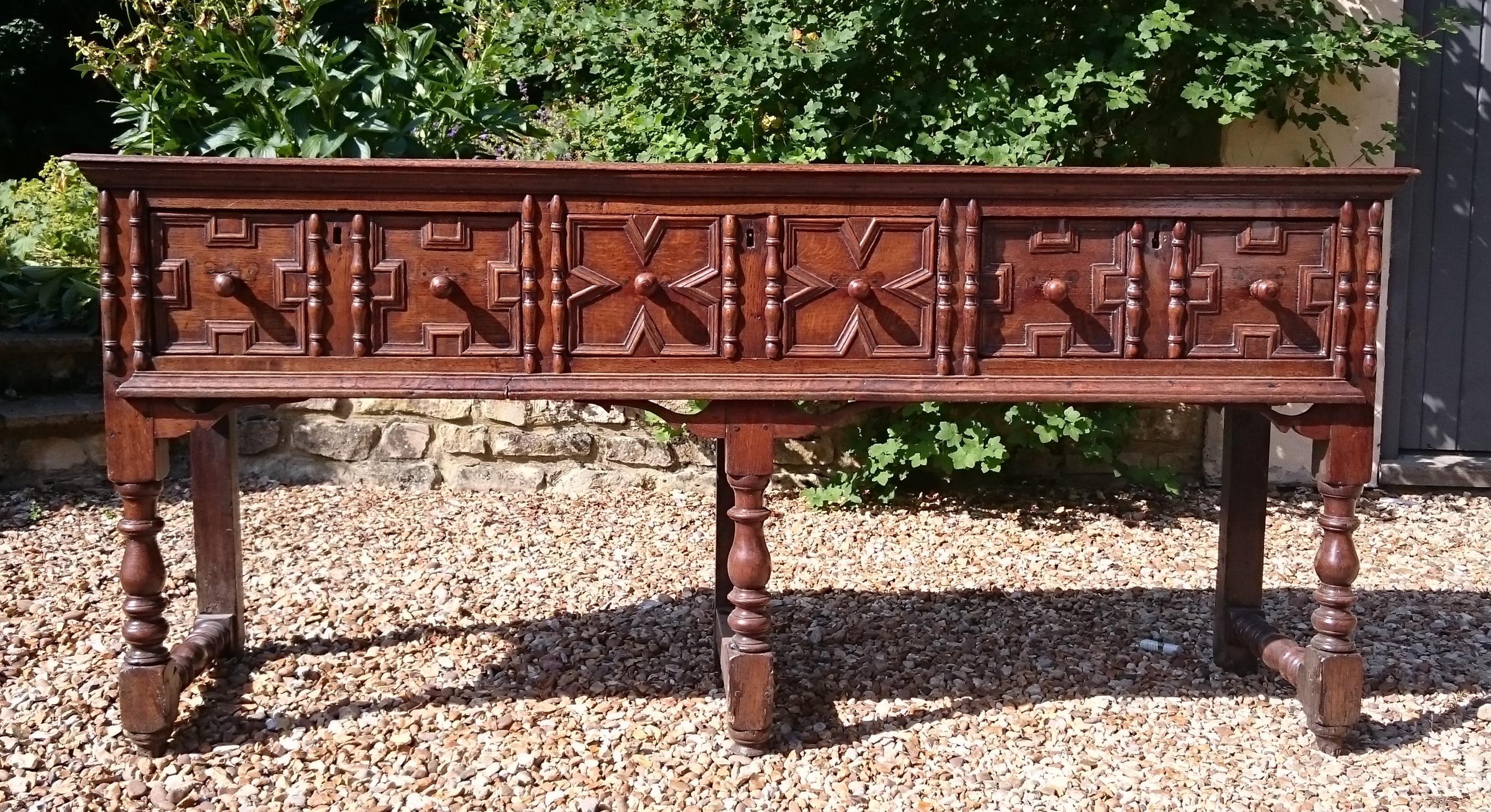 17th century oak antique dresser standing on turned legs with stretchers and with three good deep drawers in the frieze. This dresser is not too deep front to back so does not encroach on the room more than necessary.

English, circa