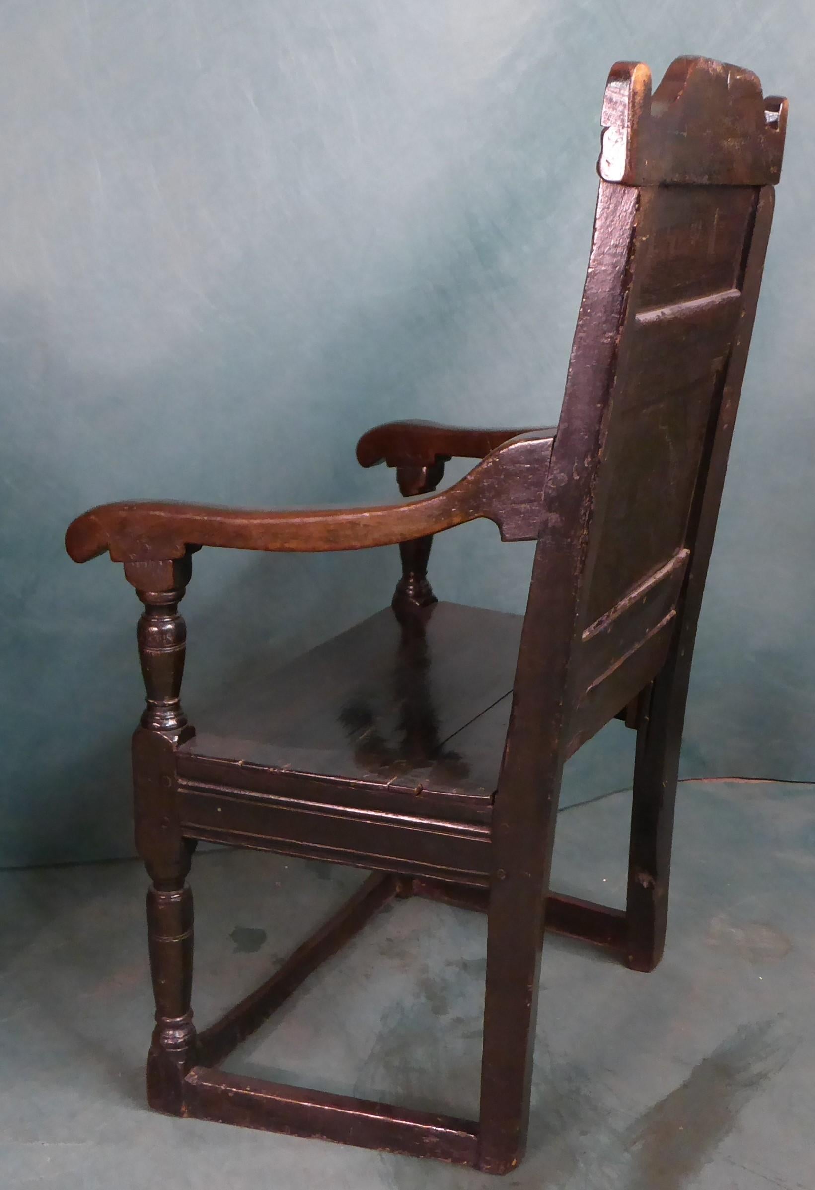 European 17th, century oak arm chair superbly carved with original patina For Sale