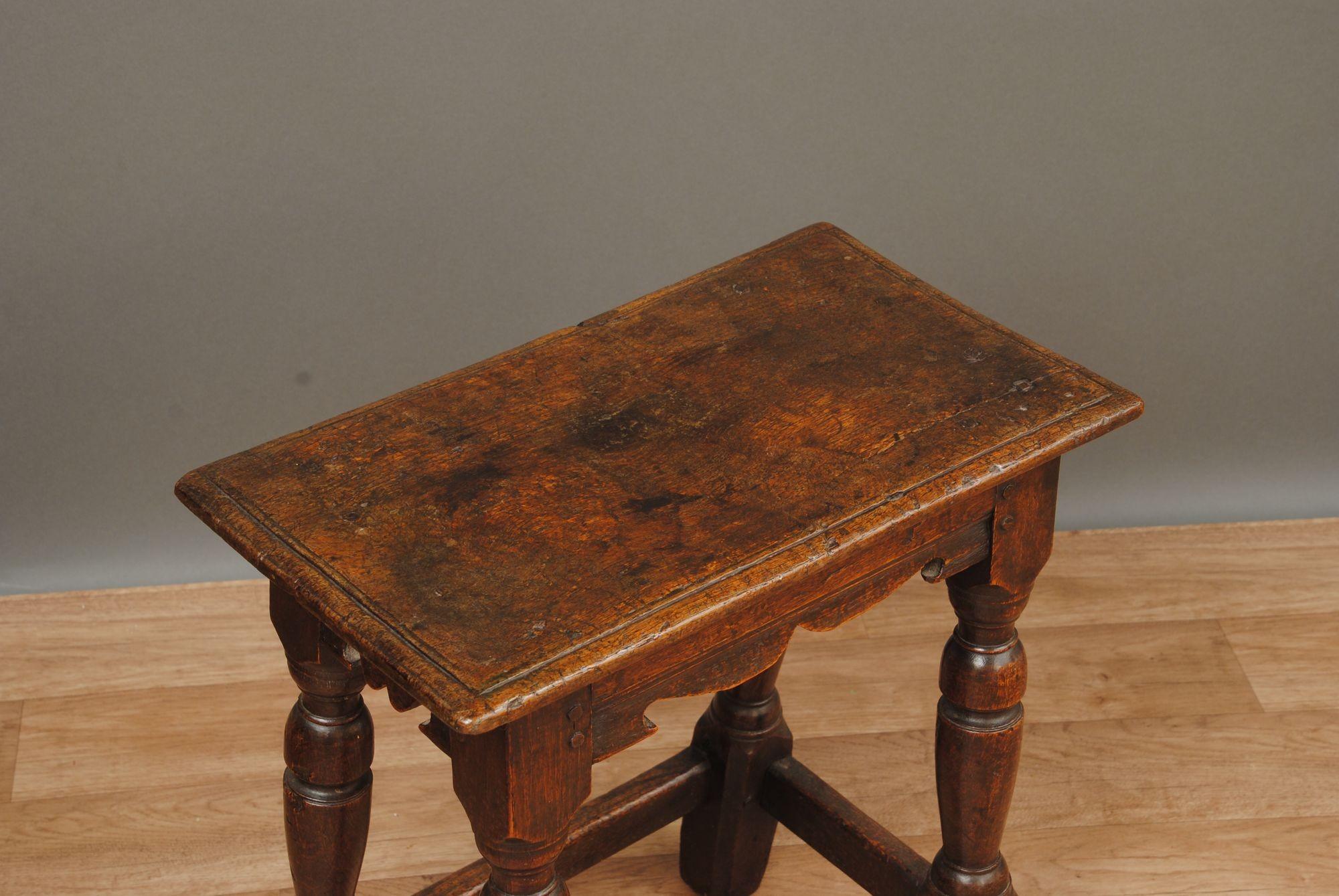 A very original 17th century oak joint stool of good colour and original patina.