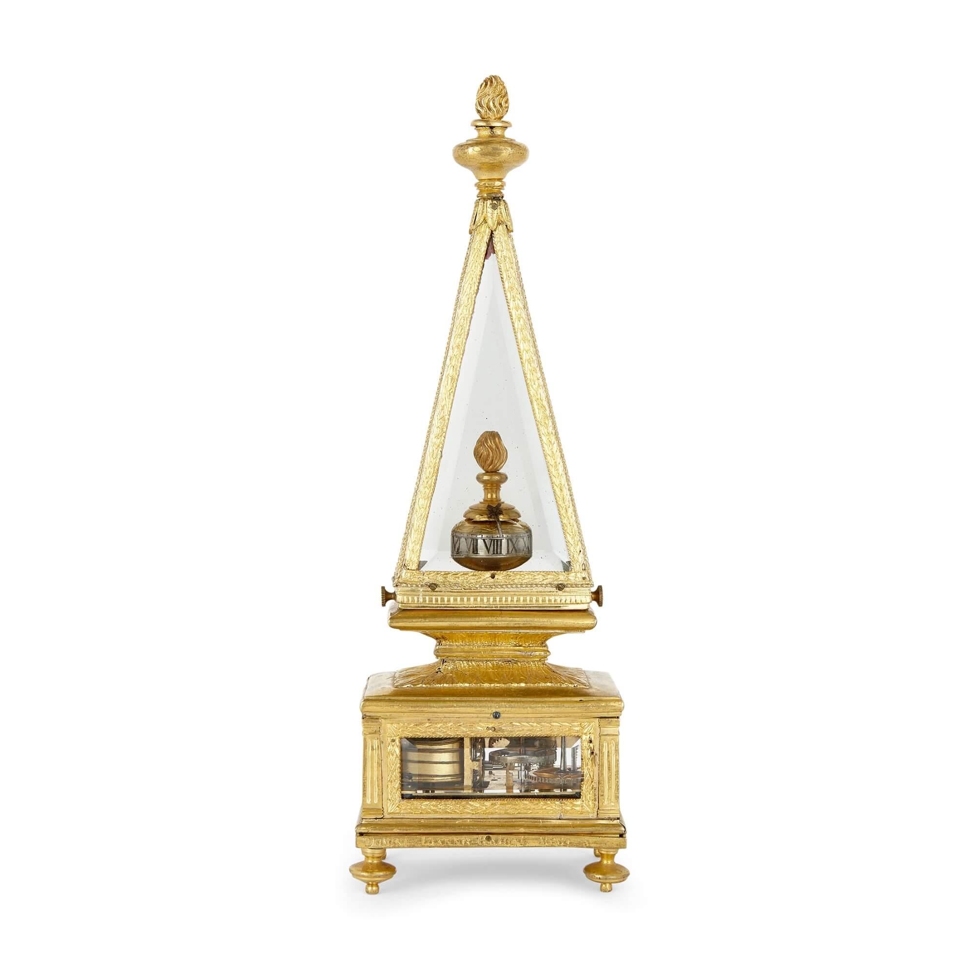 17th Century obelisk-shaped table clock
Italian, 17th Century
Height 28cm, width 9cm, depth 7cm

A stunning piece from the 17th century, this table clock is a precious element of horological artistry and mechanical innovation. Encased in gilt and