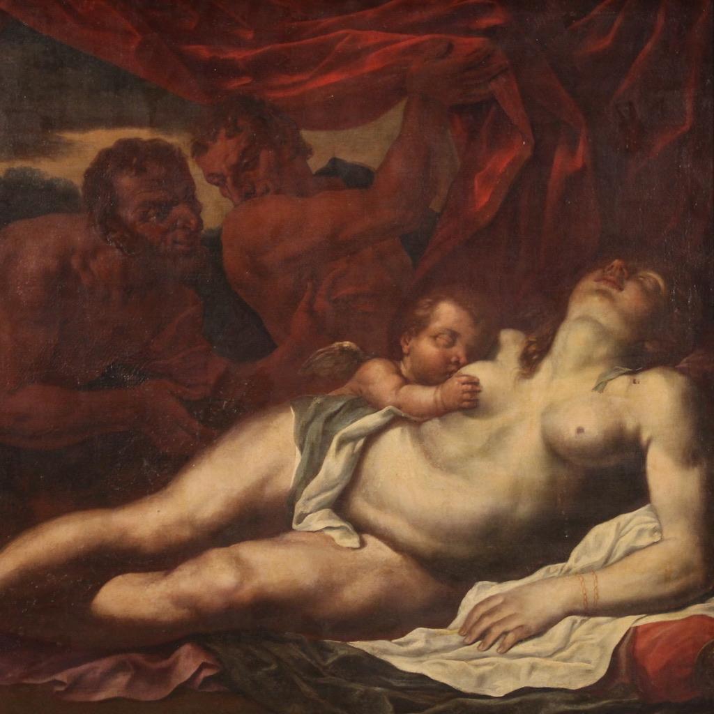 Grande peinture mythologique de la seconde moitié du XVIIe siècle. Peinture à l'huile sur toile représentant une merveilleuse Vénus endormie. Deux splendides faunes soulèvent le rideau et révèlent le corps nu de la déesse alors qu'elle allaite son
