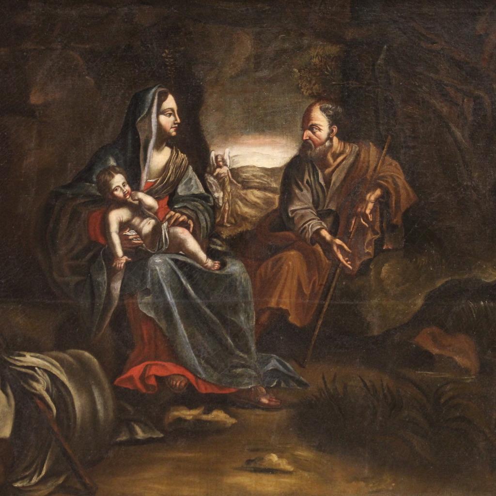 Antique Italian painting from the 17th century. Oil artwork on canvas depicting a religious subject of good pictorial quality, the Flight into Egypt. Herod the Great wanted to kill all children under two years old because the prophecies spoke of the