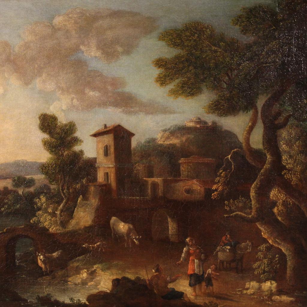 Antique Italian painting from the second half of the 17th century. Oil on canvas artwork depicting a wonderful bucolic landscape with a village, common people and grazing animals. With a balanced use of perspective planes we find a peasant family in