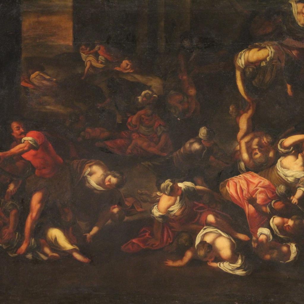 Antique Italian painting from the first half of the 17th century. Oil painting on canvas, first canvas, depicting a high quality copy of the Massacre of the Innocents by Jacopo Robusti known as Tintoretto. The artwork is presented as a mirror image