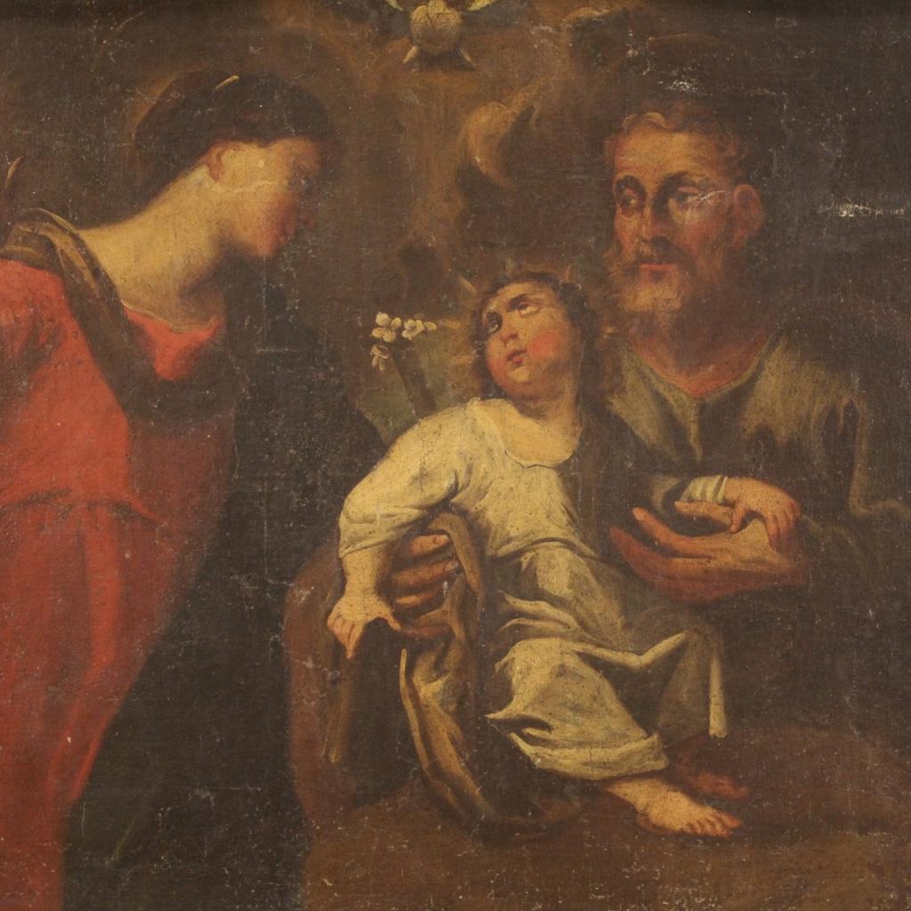 Antique Italian painting from the second half of the 17th century. Artwork oil on canvas depicting religious subject Holy Family with the holy spirit of good pictorial quality. Painting that develops horizontally, rectangular in shape, adorned with