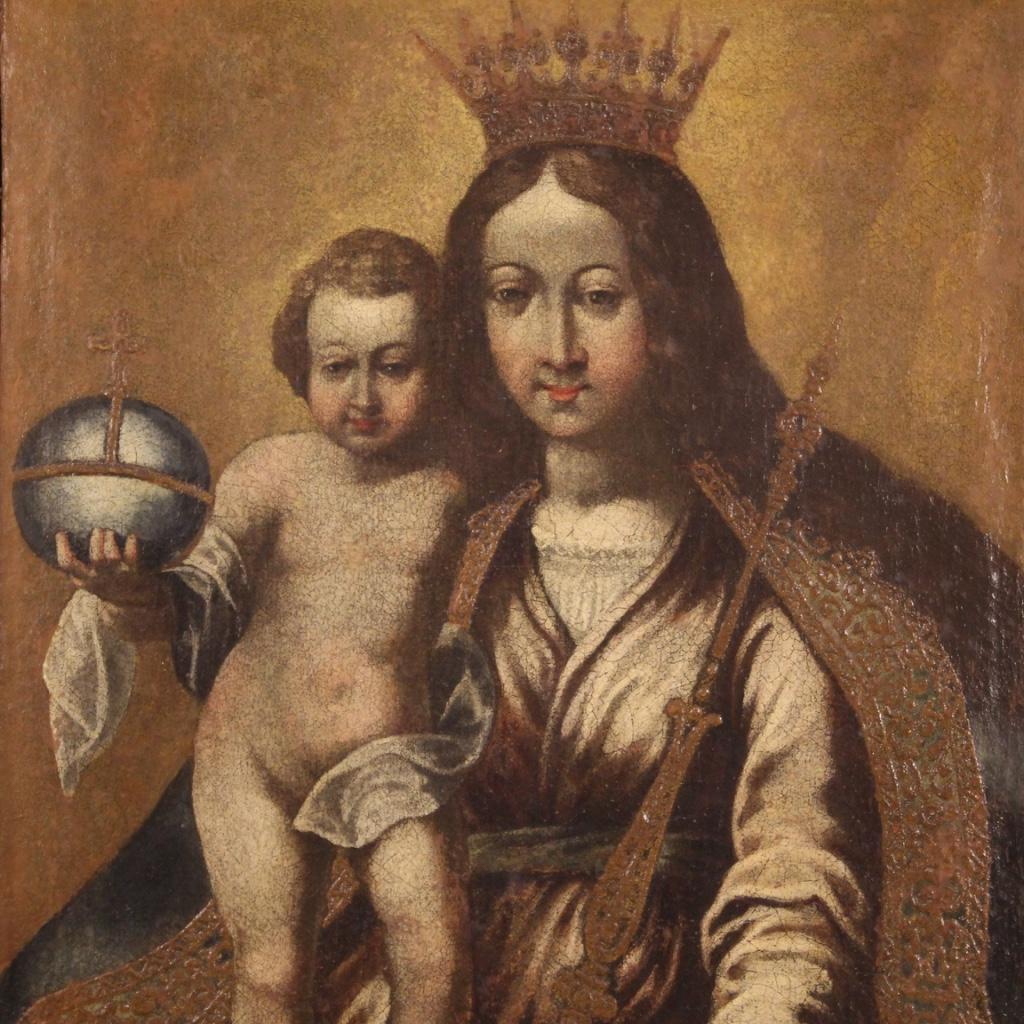 Antique Italian painting from the 17th century. Artwork oil on canvas depicting Madonna with child of good pictorial quality. Painting of great character for antique dealers, interior decorators and collectors of ancient sacred art. 19th century