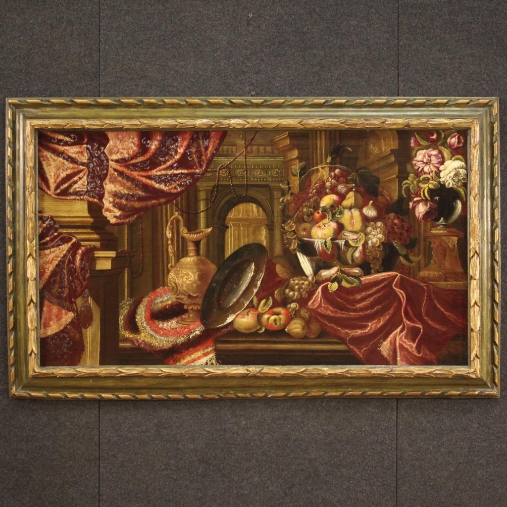Antique Italian painting from the second half of the 17th century. Framework oil on canvas depicting amazing still life with architectures, flowers, fruit, cups and fabrics of fabulous pictorial hand. Framework of great measure and impact, for