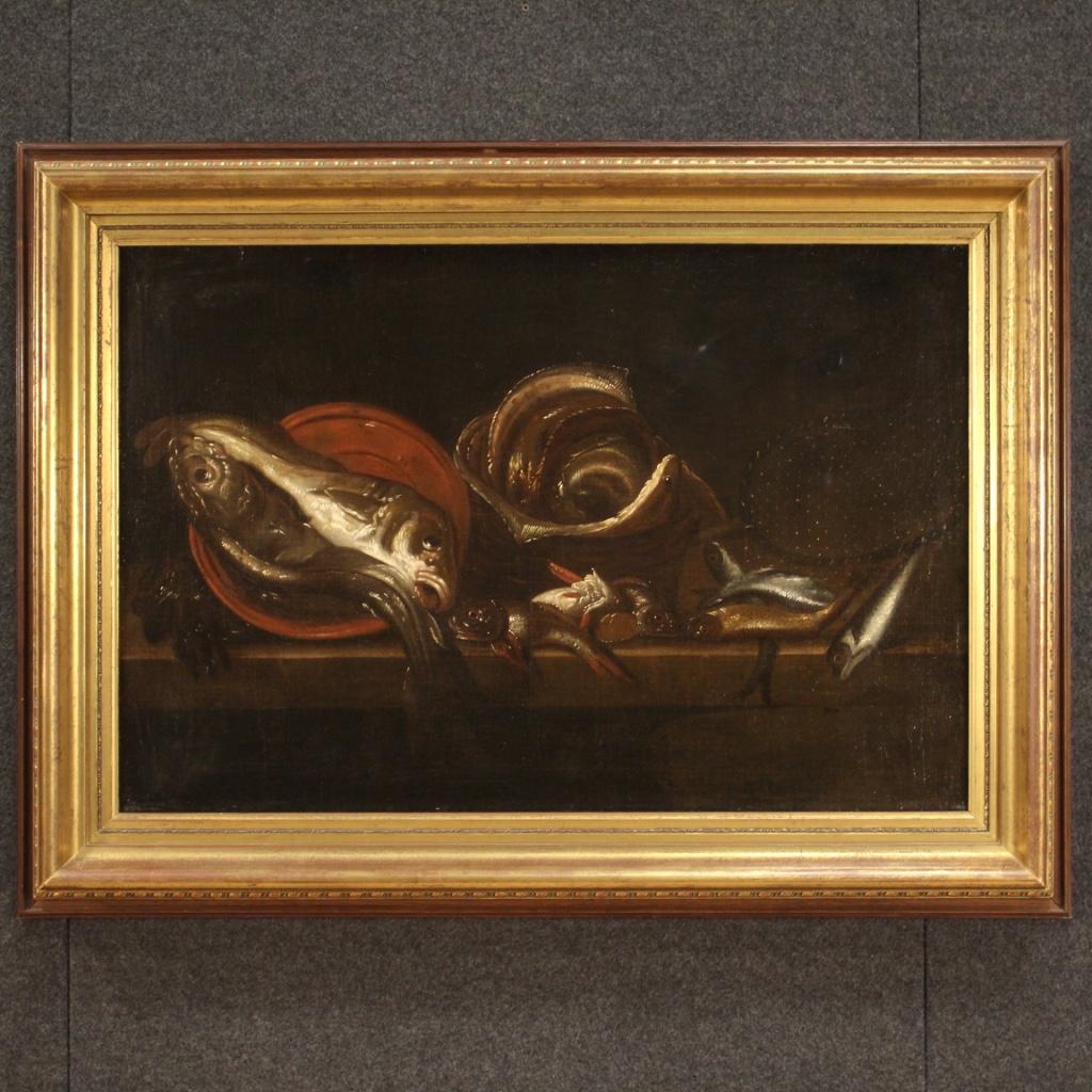 Antique Italian painting from the 17th century. Framework oil on canvas of the Neapolitan school depicting a typical subject of the representations of the famous dynasty of Recco painters, fabulous still life with fish and fisherman's tools of