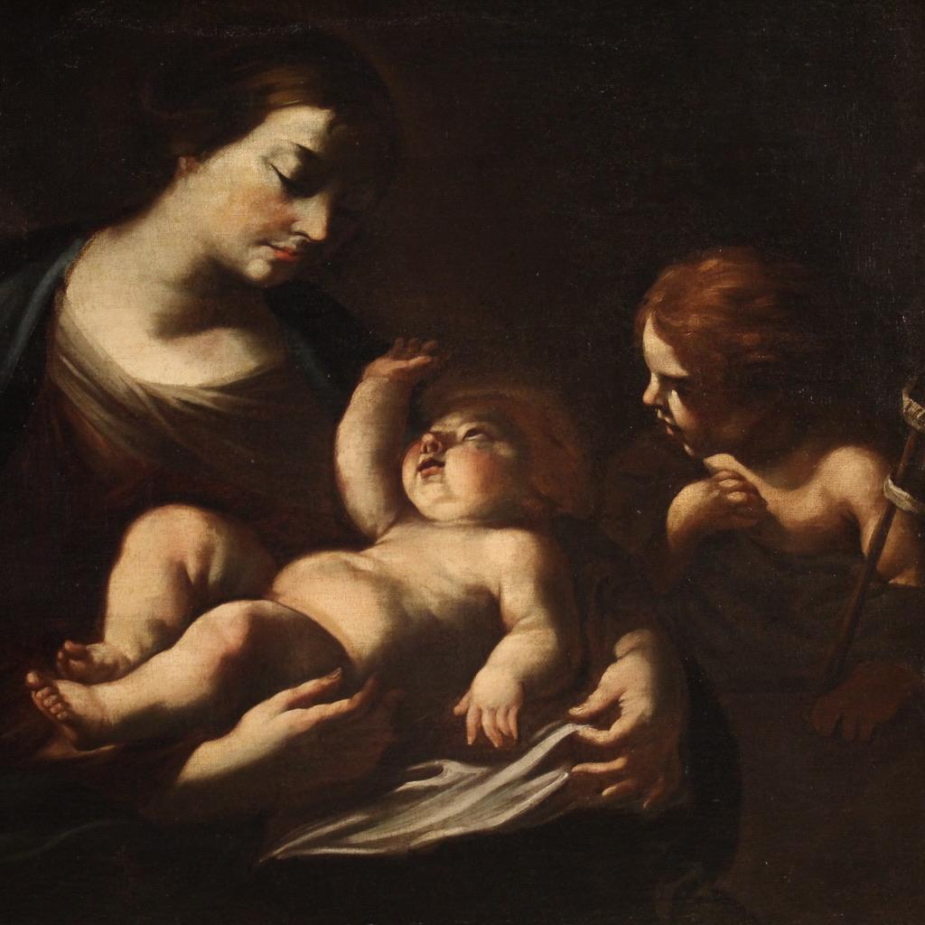 Antiguo cuadro italiano del siglo XVII. Obra de arte al óleo sobre lienzo que representa una maravillosa Sagrada Familia. Pintura de notable calidad pictórica, especialmente evidente en el magistral uso de la técnica del claroscuro para dar volumen