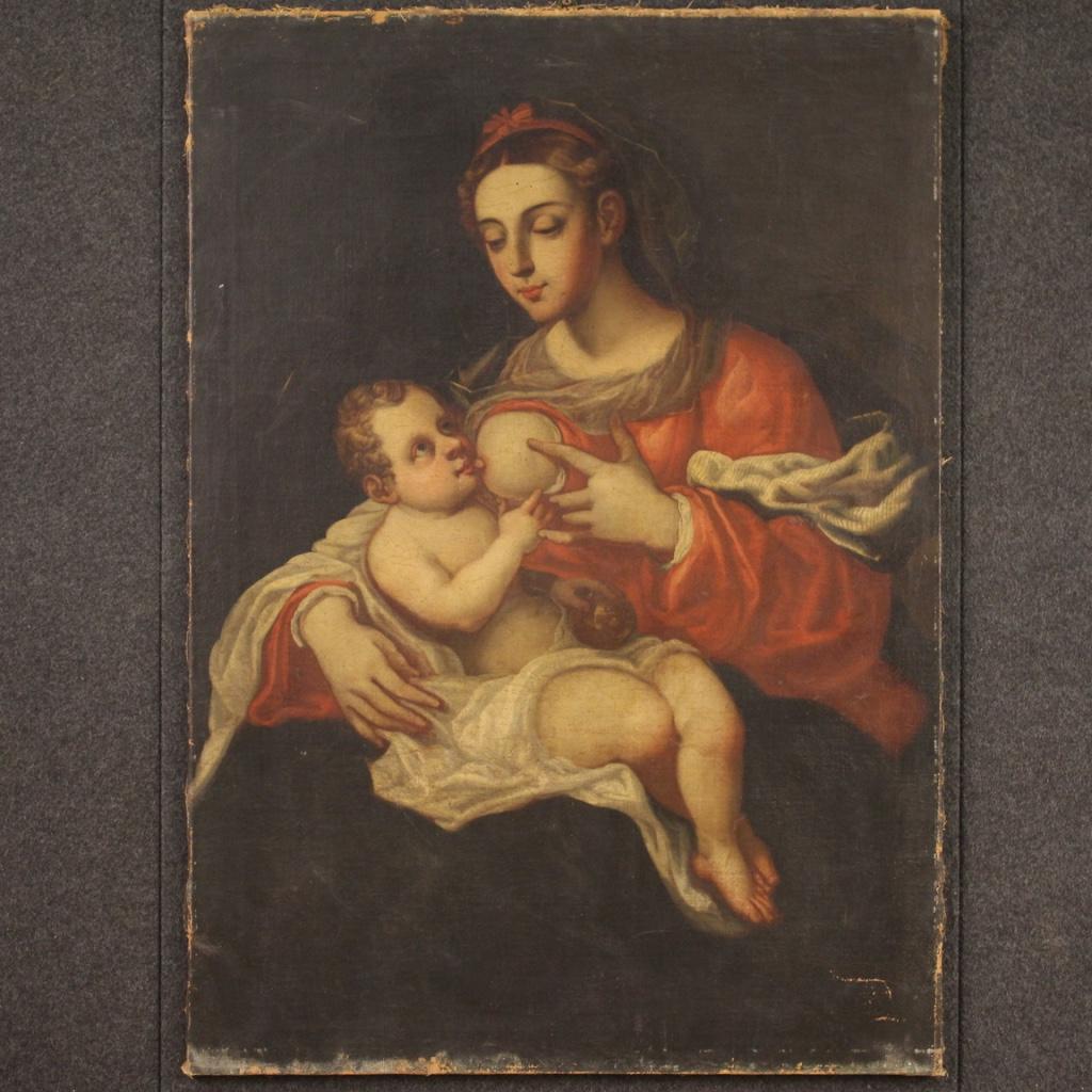 Antique Italian painting from the second half of the 17th century. Artwork oil on canvas, on the first canvas, depicting a religious subject Madonna nursing the Child of excellent pictorial quality. Beautifully sized and pleasantly decorated