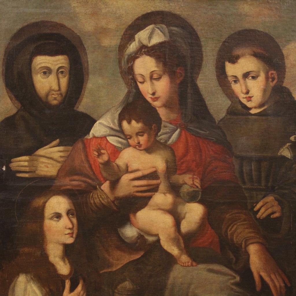 Antique Italian painting from 17th century. Oil painting on canvas depicting Virgin with child and saints of excellent pictorial quality. Painting in beautiful patina, for antique dealers and antique painting collectors. Framework that has undergone
