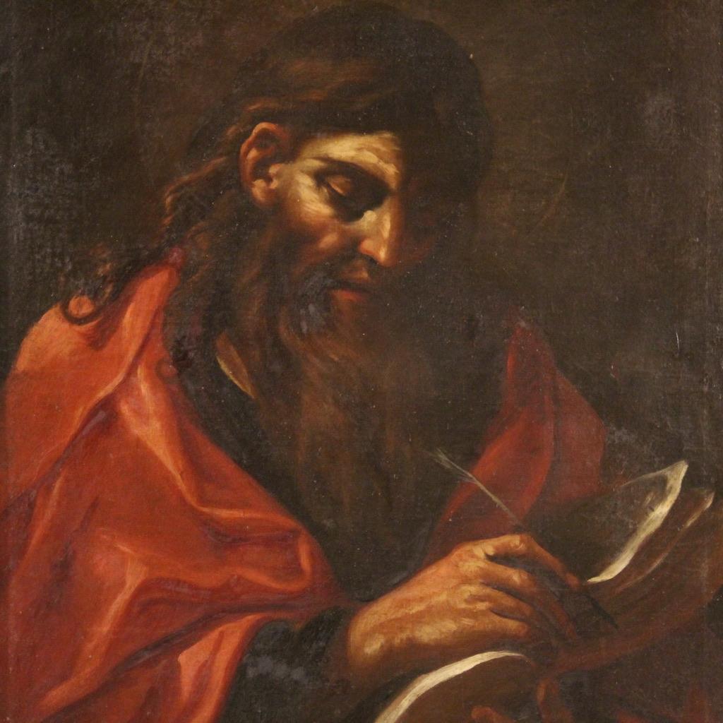 Italian painting from the second half of the 17th century. Oil artwork on canvas depicting the Apostle with a book identifiable as Saint Paul or Saint Luke. Painting attributable to the painter Felice Ottini, active in Rome in the 17th century,