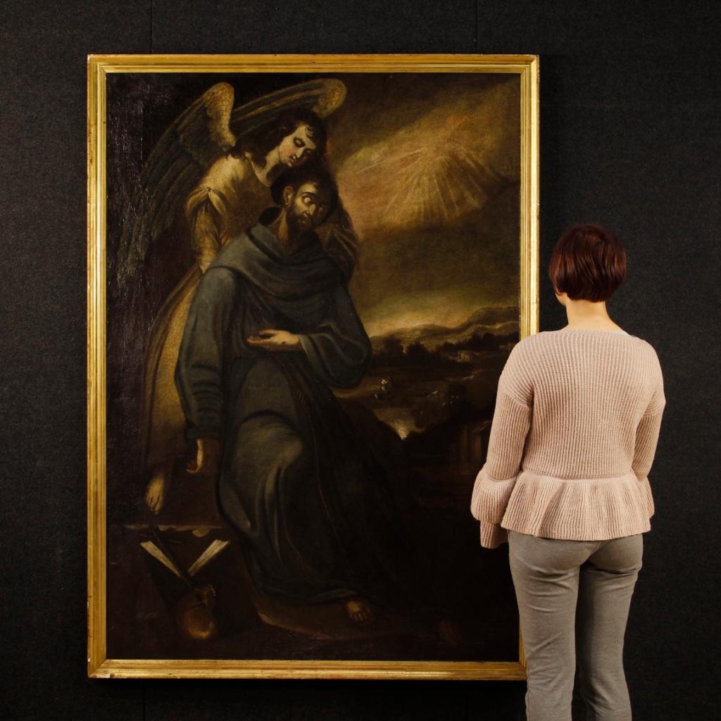 Antique Spanish painting from 17th century. Oil painting on canvas depicting the subject of sacred art St. Francis with an angel of good pictorial quality. Framework of great measure and impact, for antique dealers and collectors, with a 19th