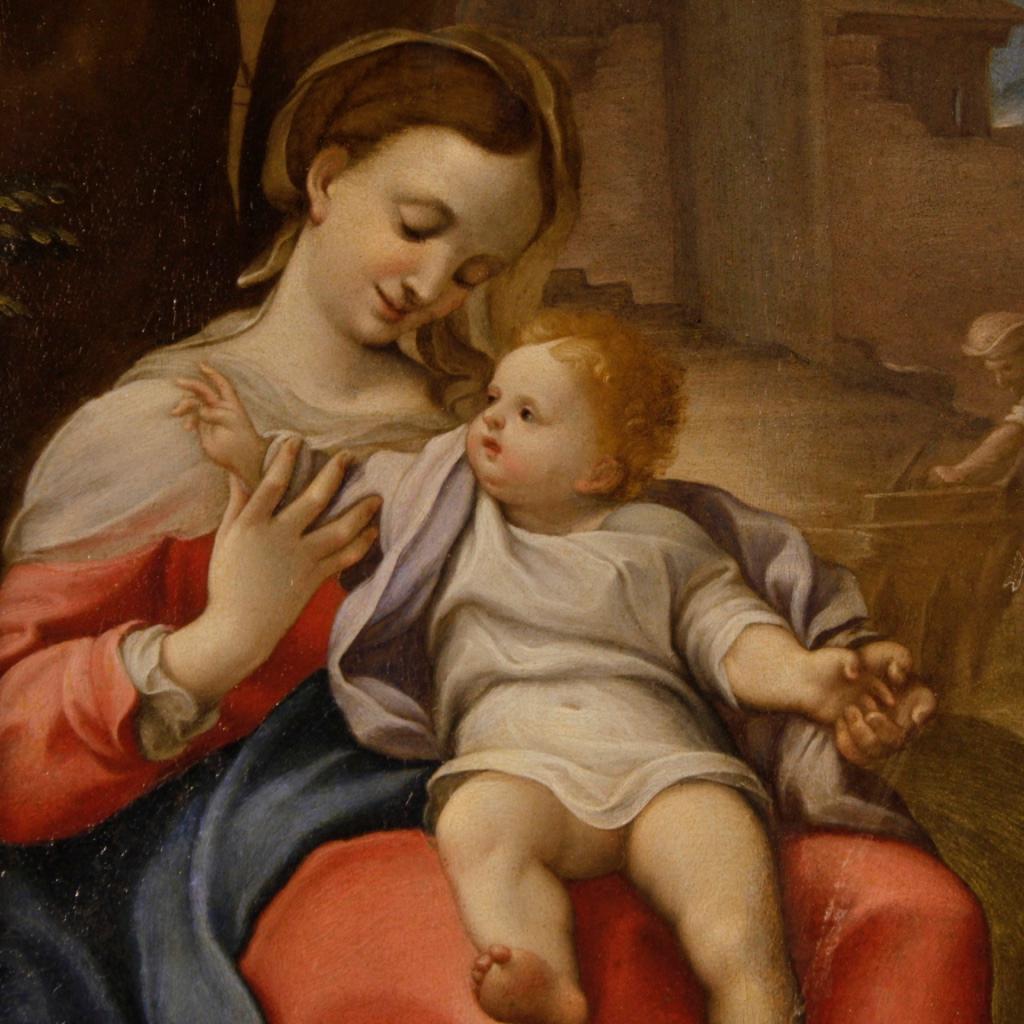 Antique Italian painting from 17th century. Oil painting on copper of exceptional pictorial quality depicting the subject of sacred art Madonna of the basket, an antique copy of the famous painting by Correggio. Framework that differs from the