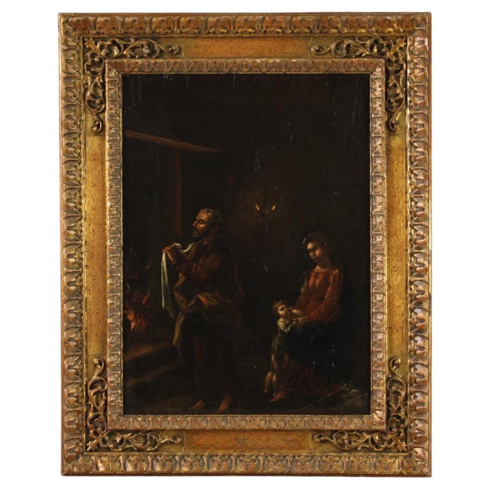 Antique Flemish panel from the second half of the 17th century. Oil artwork on panel depicting a religious subject with an interior scene with the Holy Family of good pictorial quality. 20th century frame, in wood and plaster, finely carved and