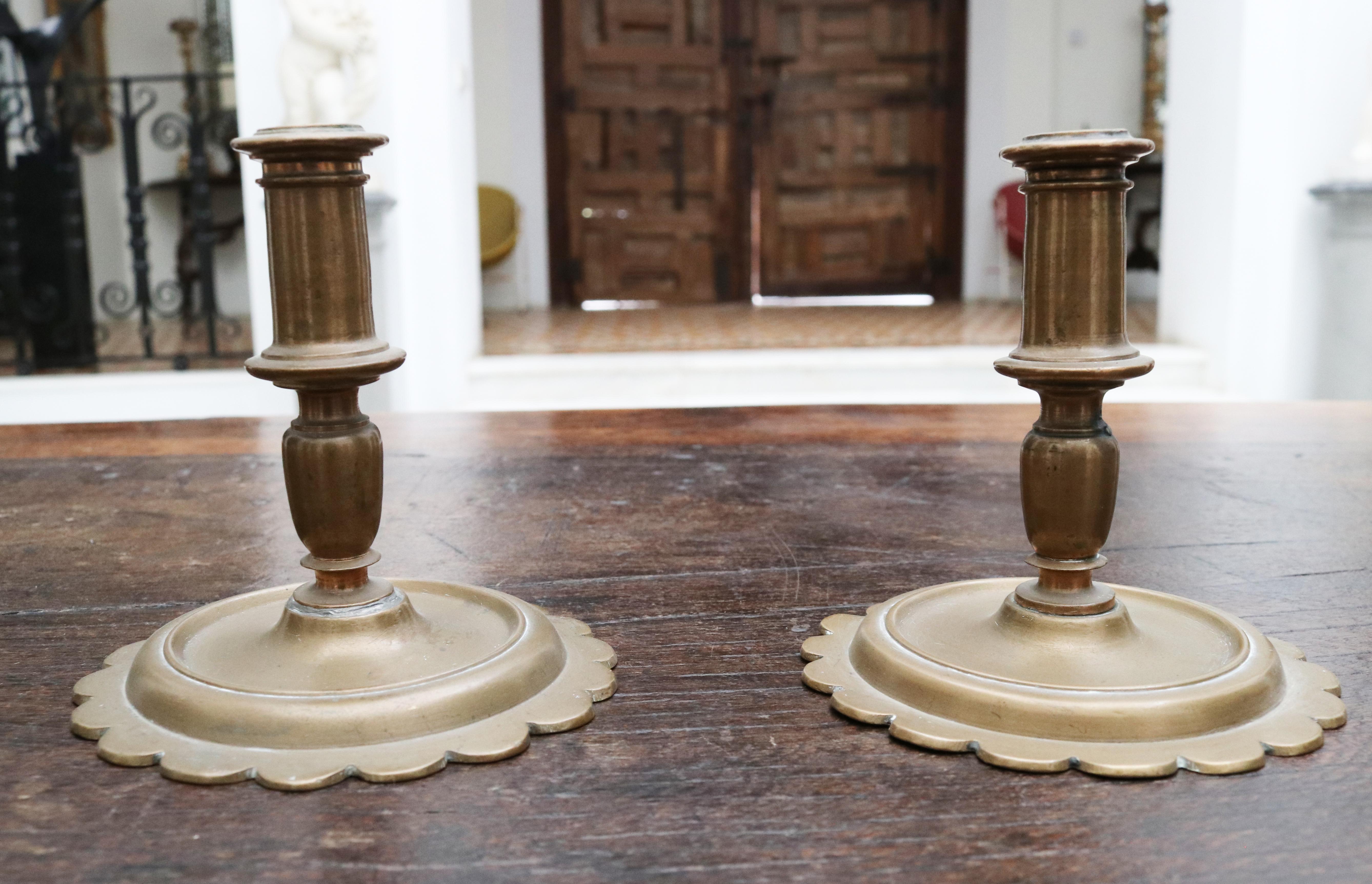 17th century pair of Spanish brass candlesticks.