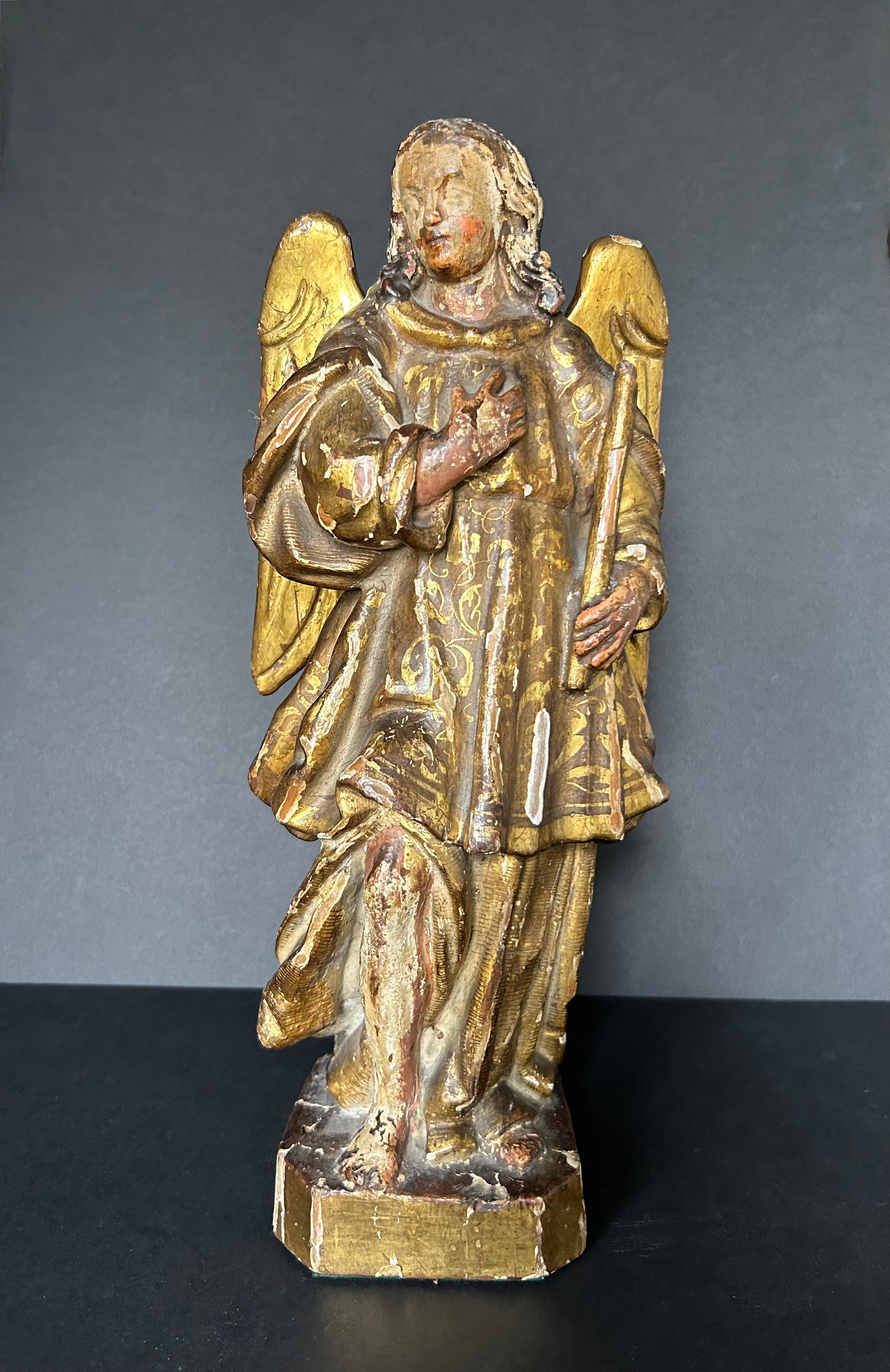 This is an exquisite, polychrome saint, or santo, possibly depicting the archangel Michael or Raphael, from the 17th or early 18th century. The statue is most likely Spanish, but possibly Italian. Beautifully carved and gilded with remnants of